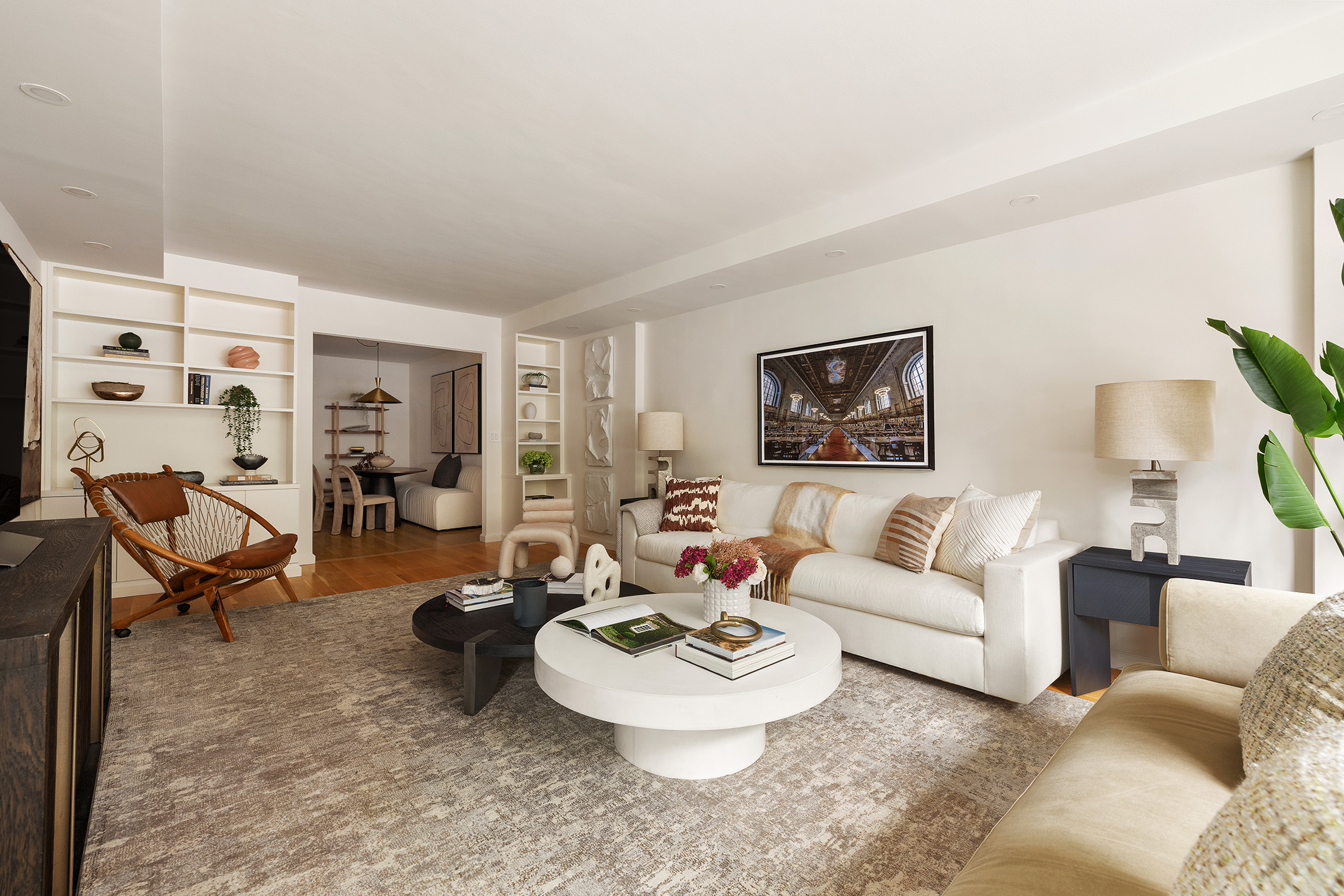 180 East End Avenue, Unit 1C Manhattan, NY 10128 - Photo 3 of 19 a living room with furniture and a table