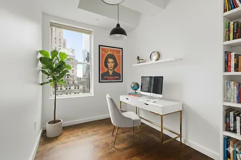 a workspace with furniture and window