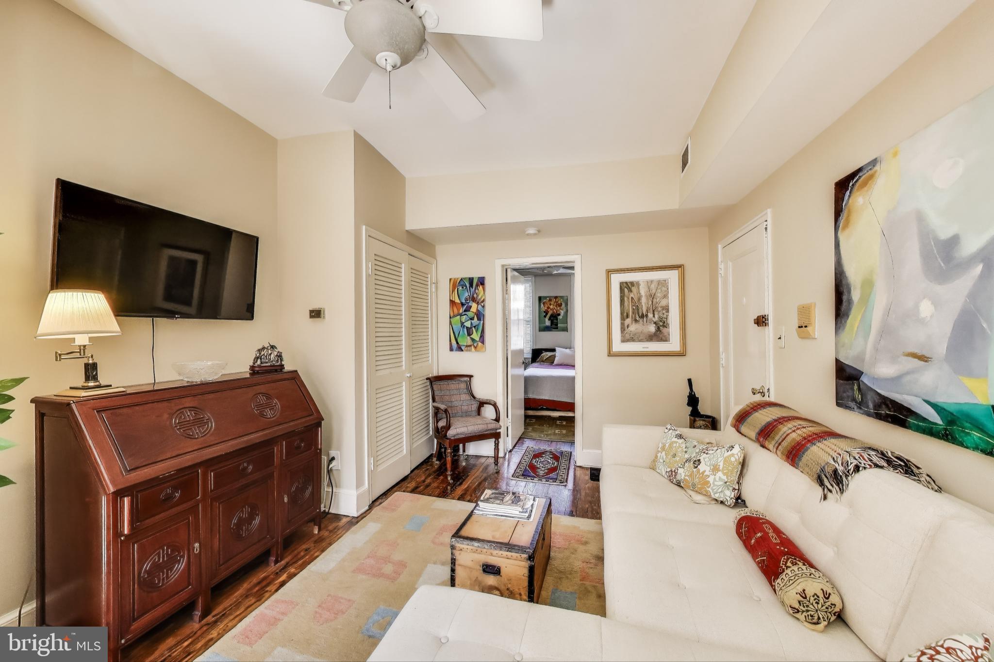 1317 Corcoran Street Northwest Washington, DC 20009 - Photo 11 of 47 a living room with furniture and a flat screen tv