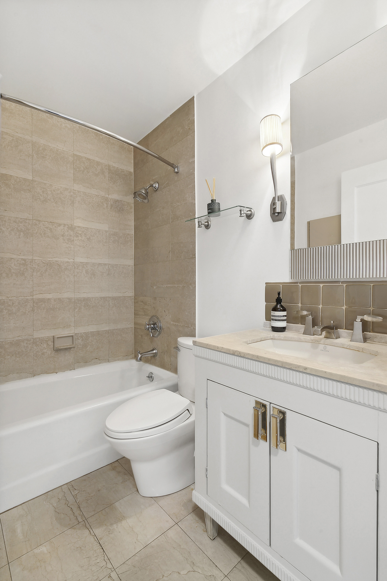 330 East 75th Street, Unit 3J Manhattan, NY 10021 - Photo 4 of 5 a bathroom with a sink a toilet and a bathtub