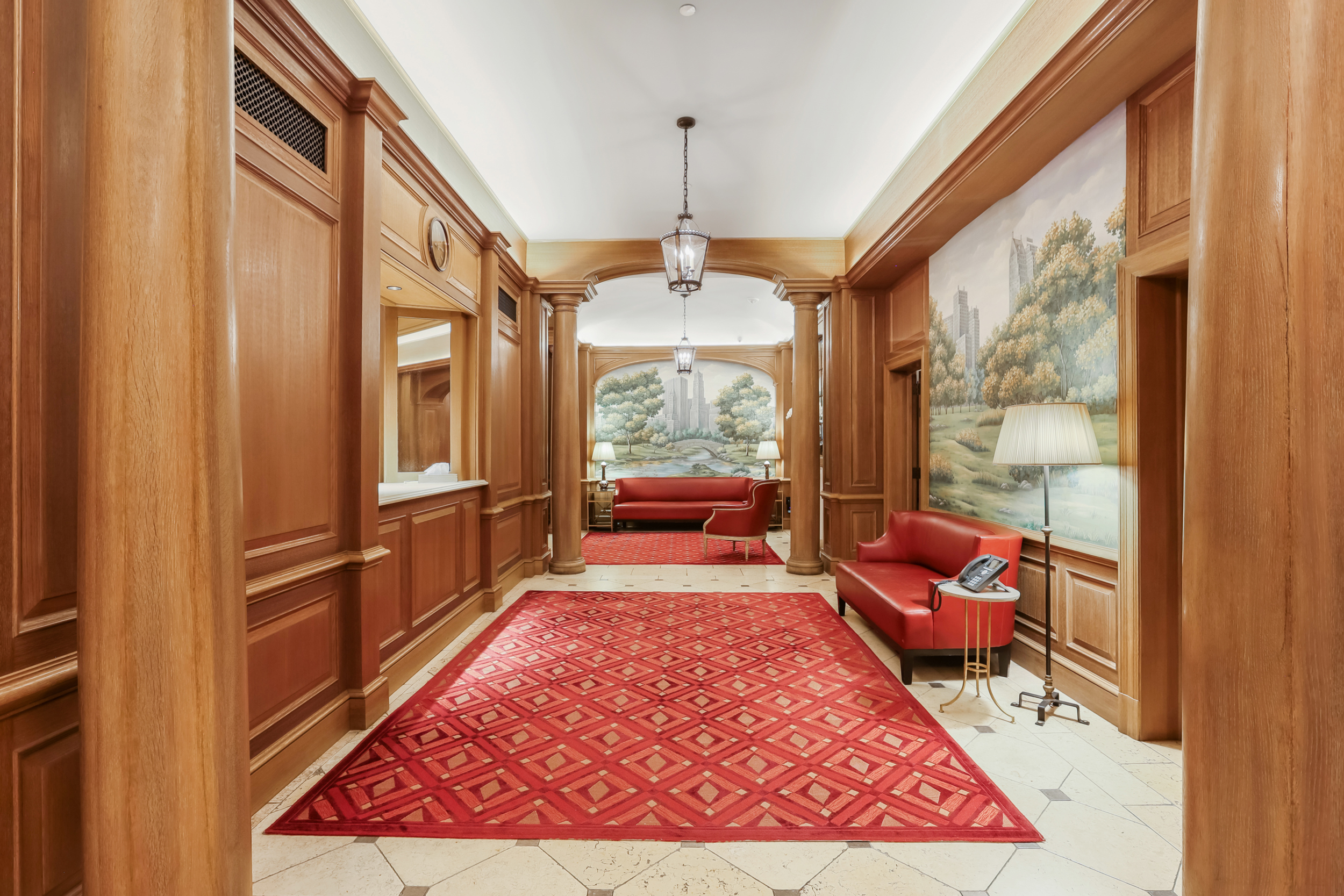 465 Park Avenue, Unit 409 Manhattan, NY 10022 - Photo 9 of 11 a living room with furniture windows and a wooden floor