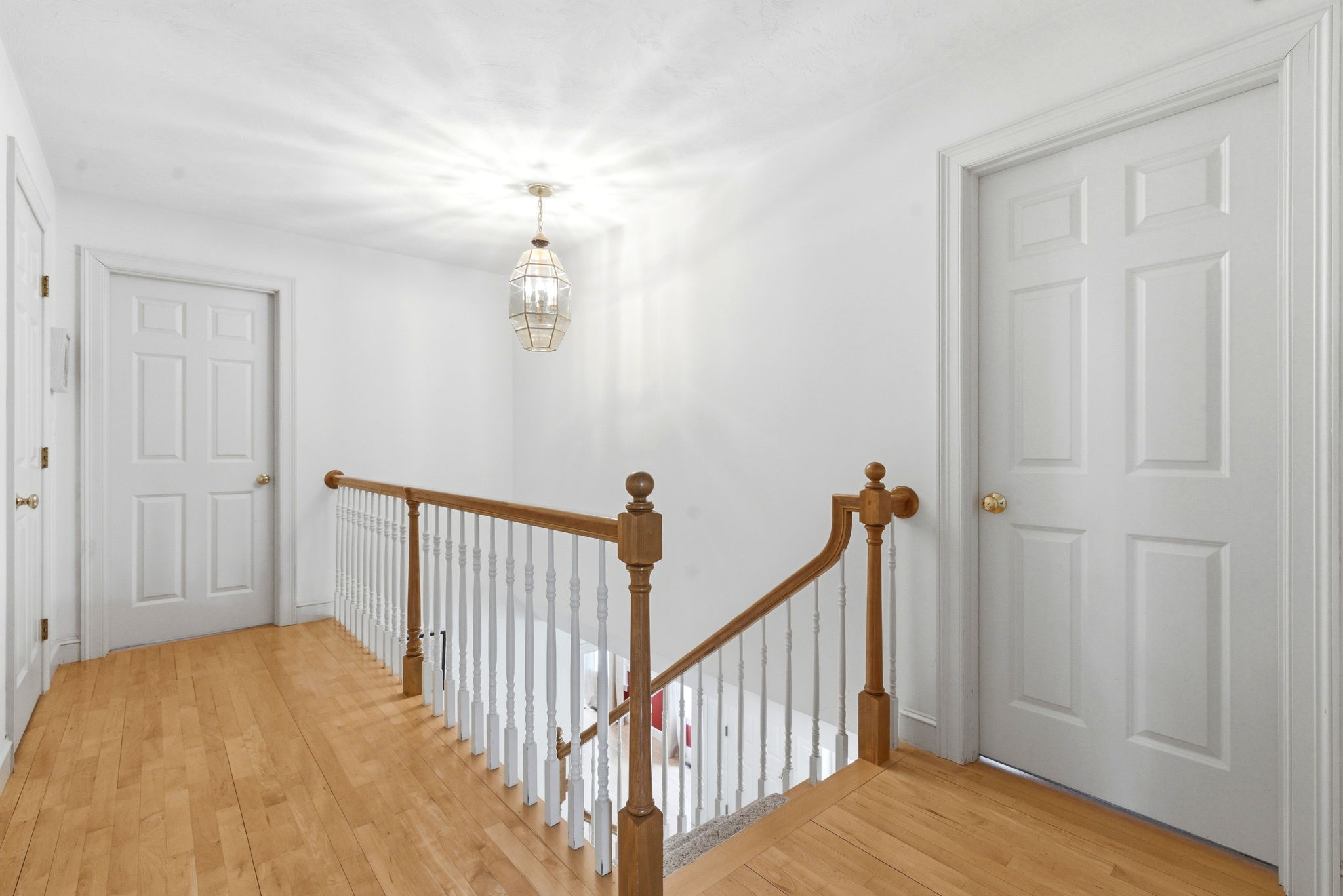 2 Laurel Street Lexington, MA 02421 - Photo 24 of 46 a view of a hallway with wooden floor and staircase