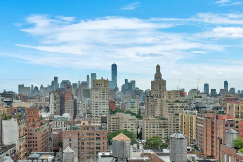 a view of a city with tall buildings