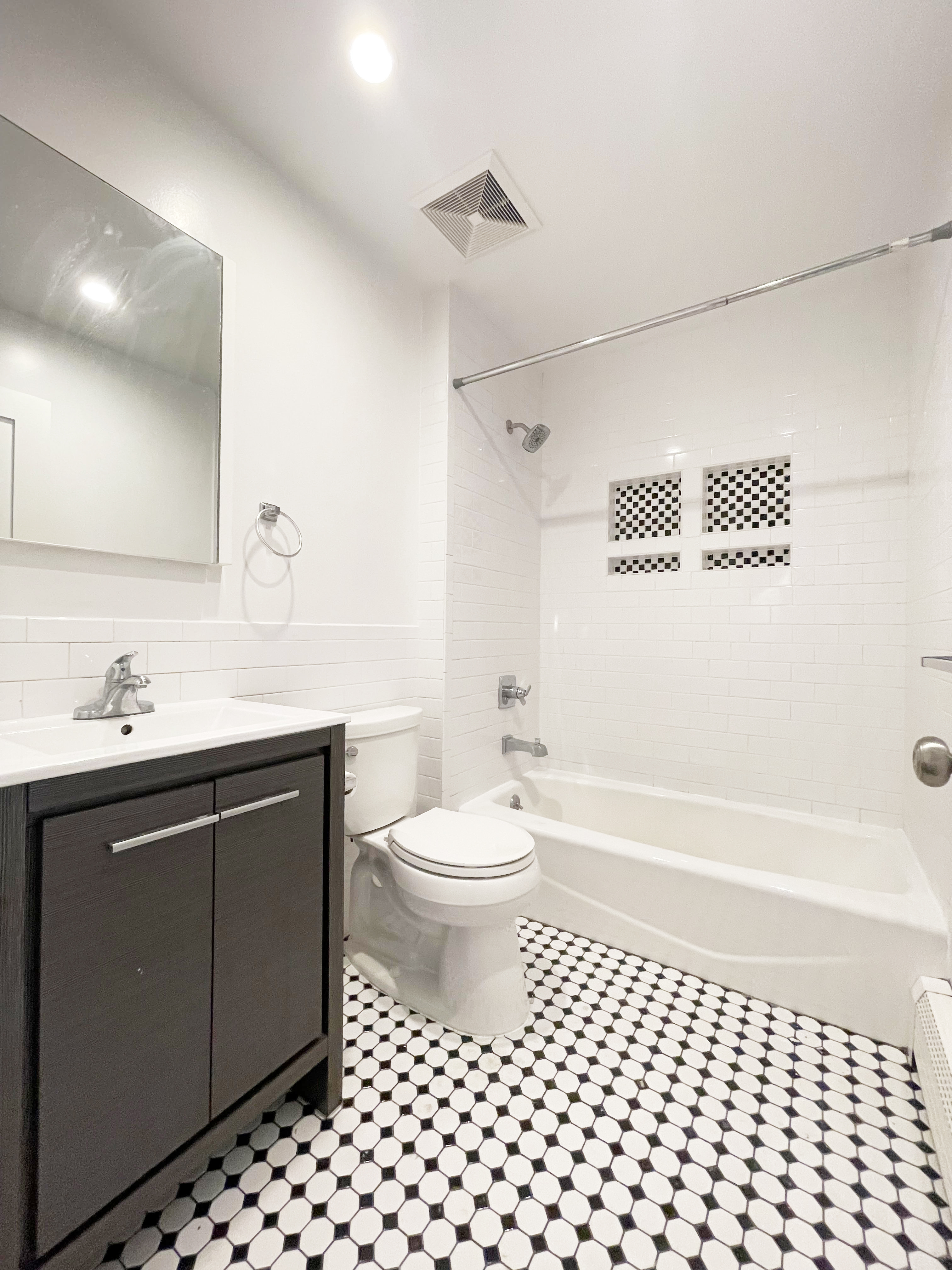 157 Prospect Avenue, Unit 1 Brooklyn, NY 11215 - Photo 7 of 10 a bathroom with a sink a toilet and shower