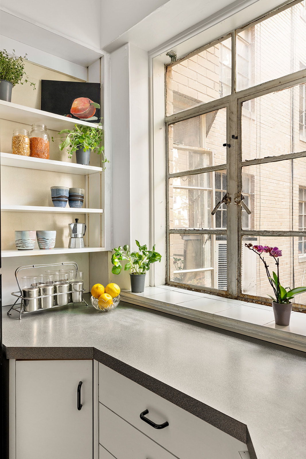 57 Montague Street, Unit 2G Brooklyn, NY 11201 - Photo 6 of 8 a kitchen with a large window and cabinets