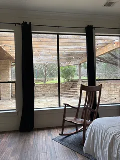 a view of a room with furniture and windows