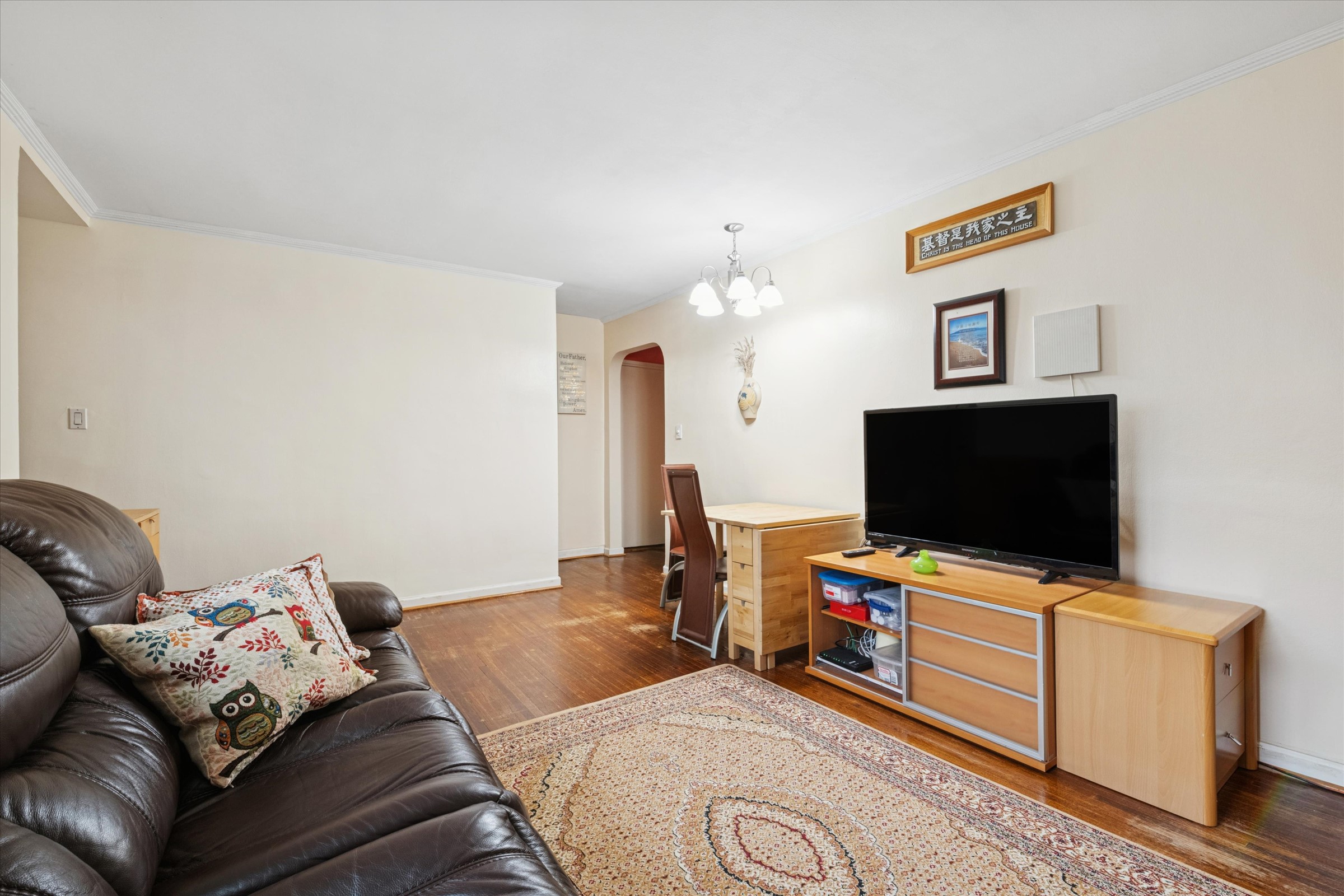 74-22 220th Street Oakland Garden, NY 11364 - Photo 5 of 16 a living room with furniture and a flat screen tv