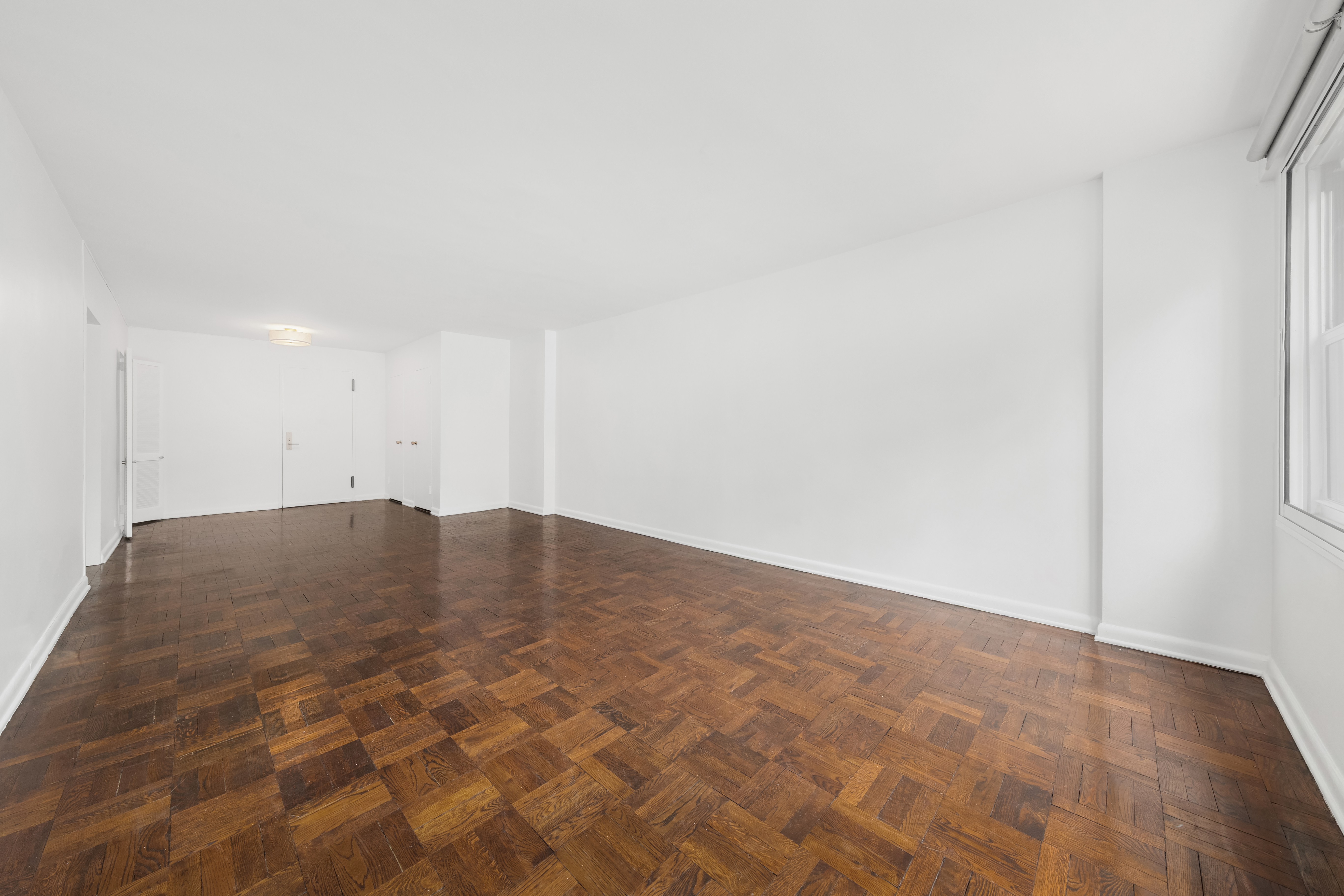 77 West 55th Street, Unit 17F Manhattan, NY 10019 - Photo 11 of 12 a view of empty room