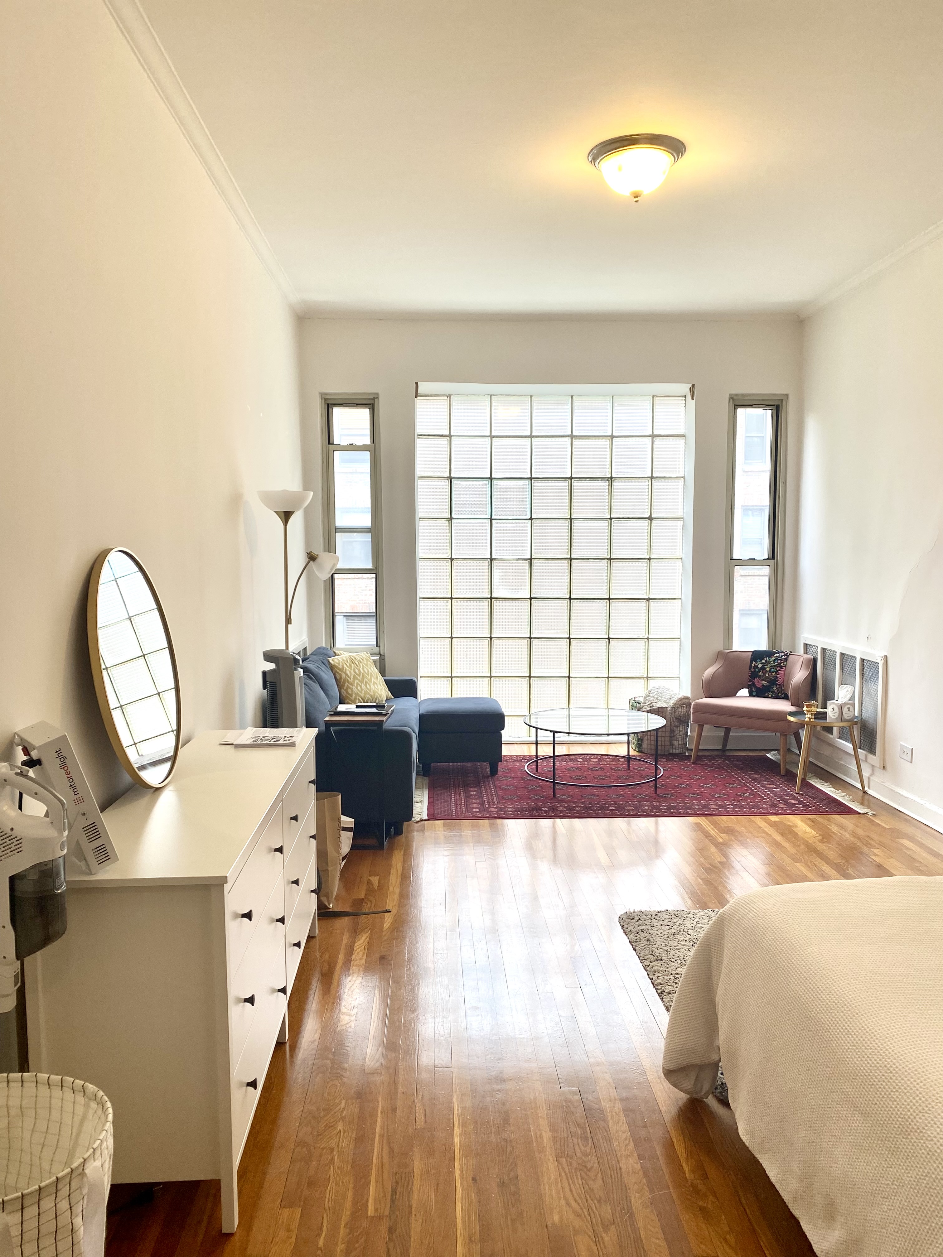330 East 58th Street, Unit 5B Manhattan, NY 10022 - Photo 1 of 11 a living room with furniture and a large window