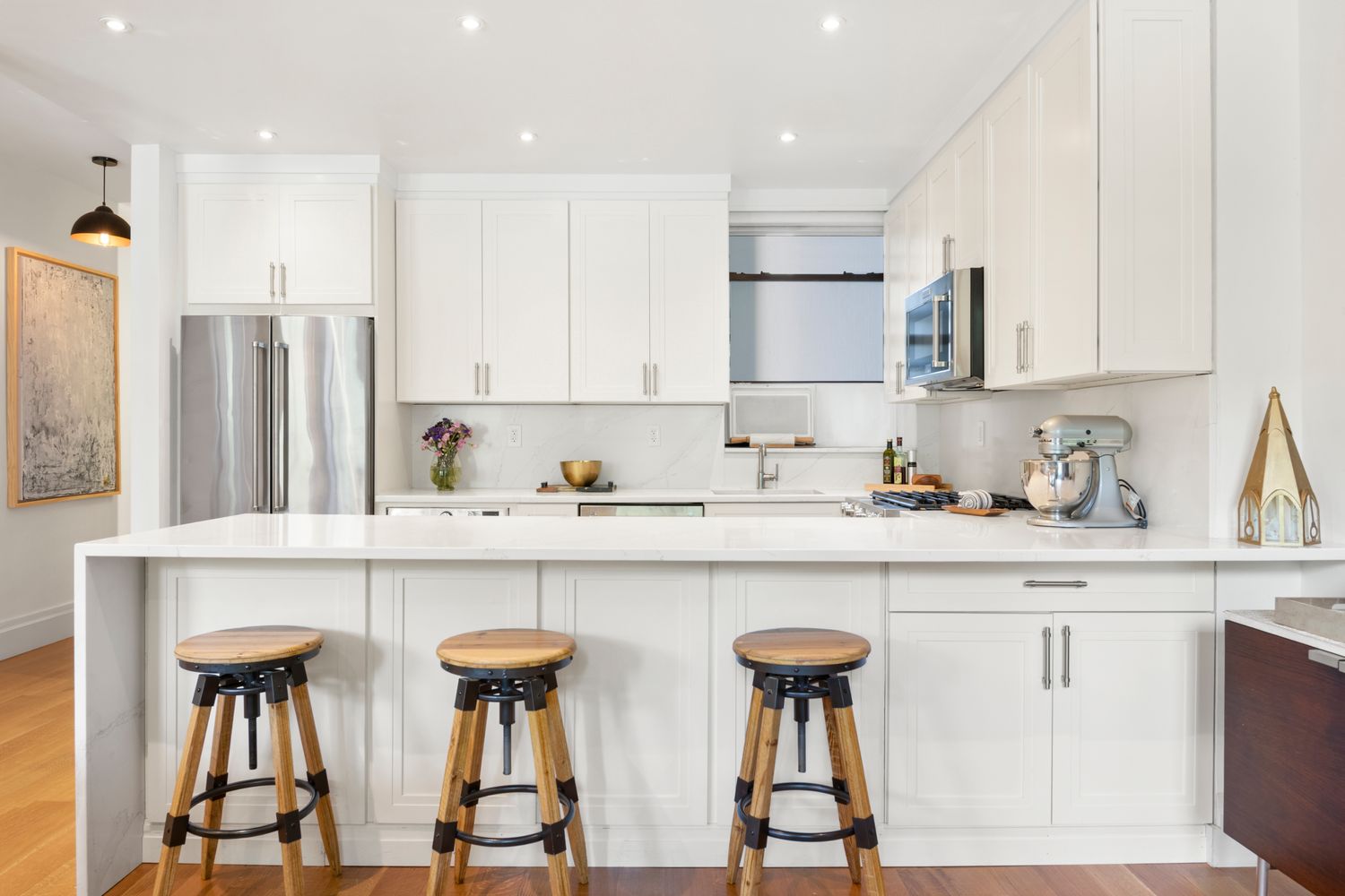 a kitchen with stainless steel appliances a sink and cabinets
