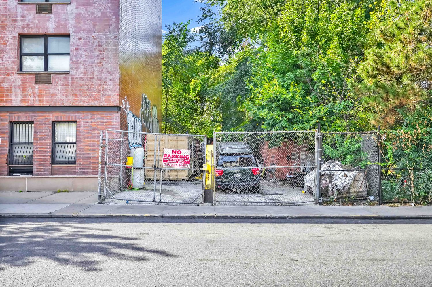 a view of road with large tree