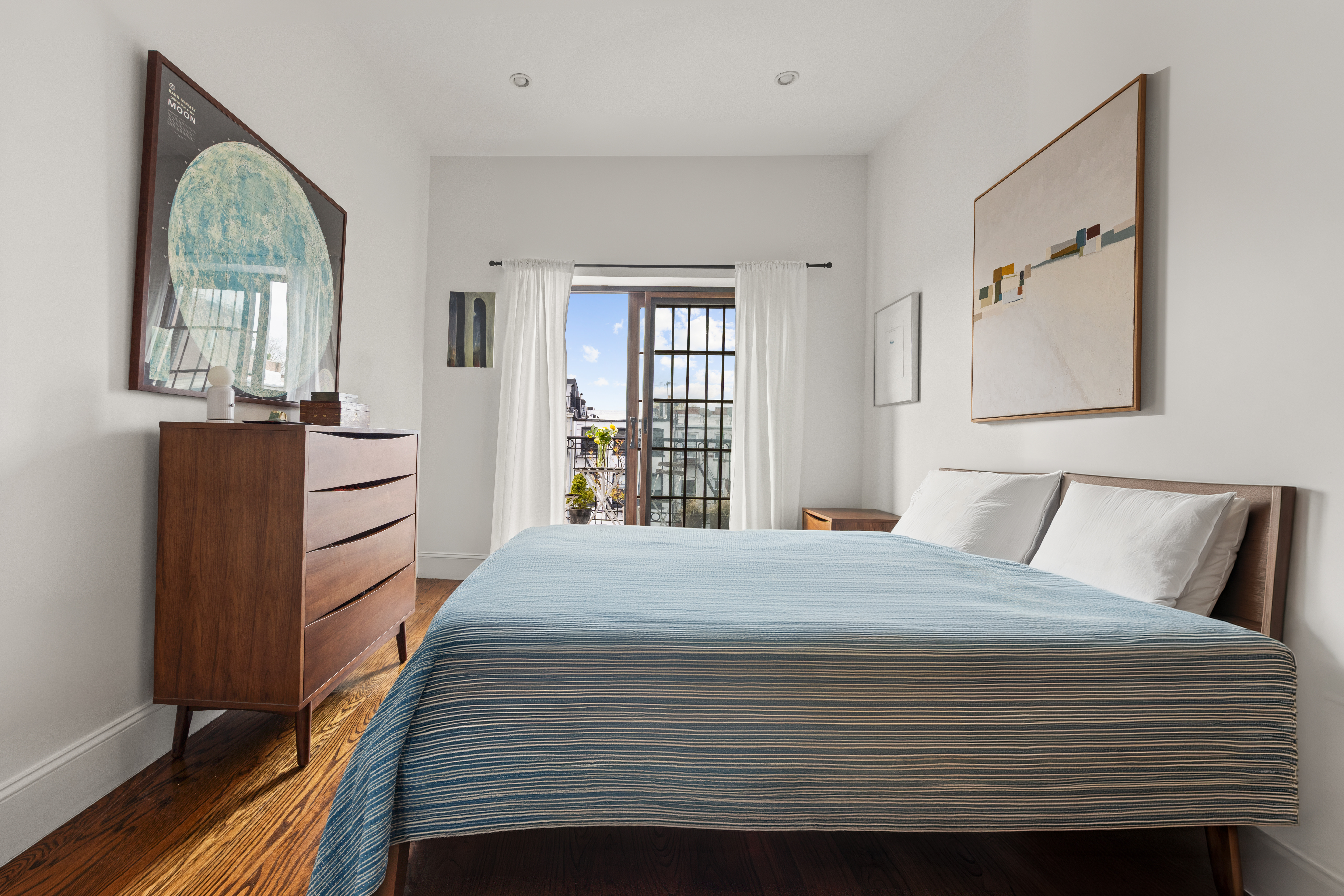 118 President Street, Unit 4 Brooklyn, NY 11231 - Photo 5 of 16 a bedroom with a bed cabinets and a window