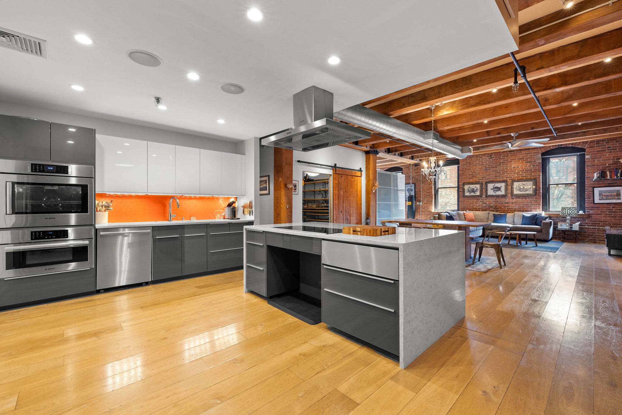 a kitchen with stainless steel appliances a stove a sink and a refrigerator