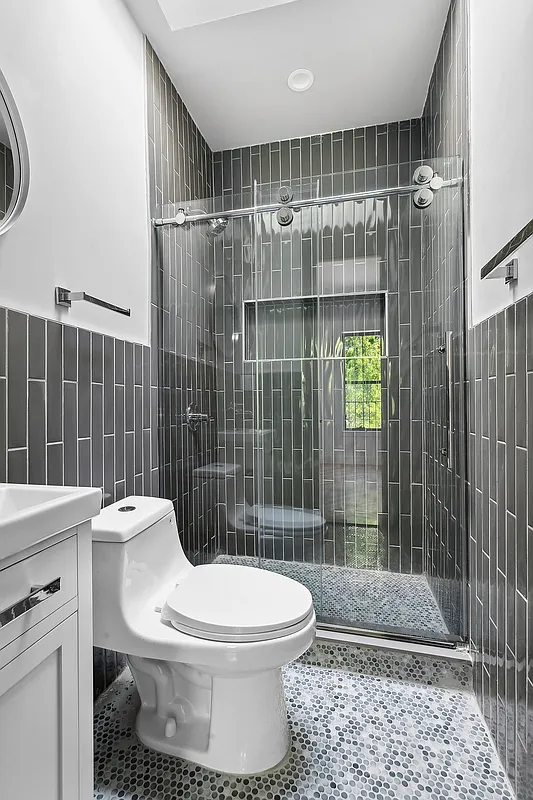 866 Bushwick Avenue, Unit 1 Brooklyn, NY 11221 - Photo 9 of 13 a bathroom with a toilet and a shower