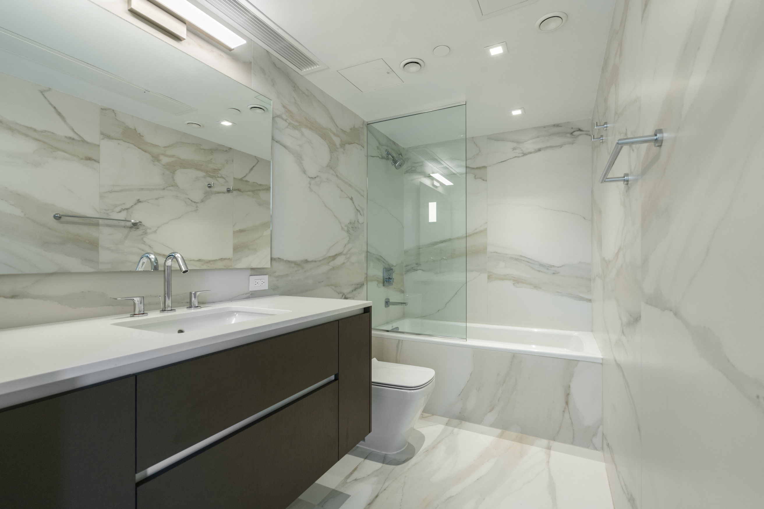 136 West Houston Street, Unit PH Manhattan, NY 10012 - Photo 20 of 26 a bathroom with a sink a toilet and shower