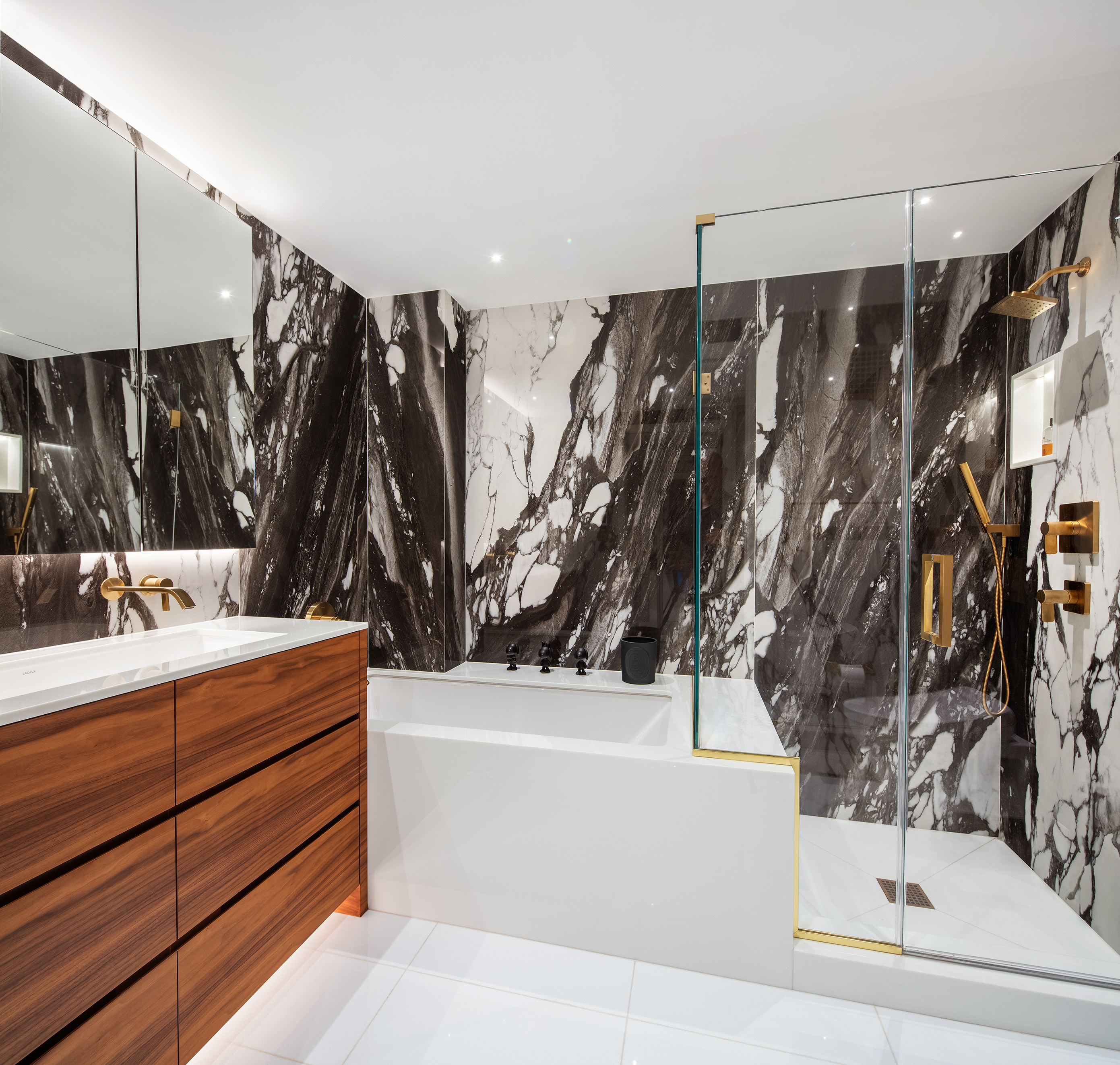 923 5th Avenue, Unit 2A Manhattan, NY 10021 - Photo 7 of 14 a bathroom with a bathtub and a shower