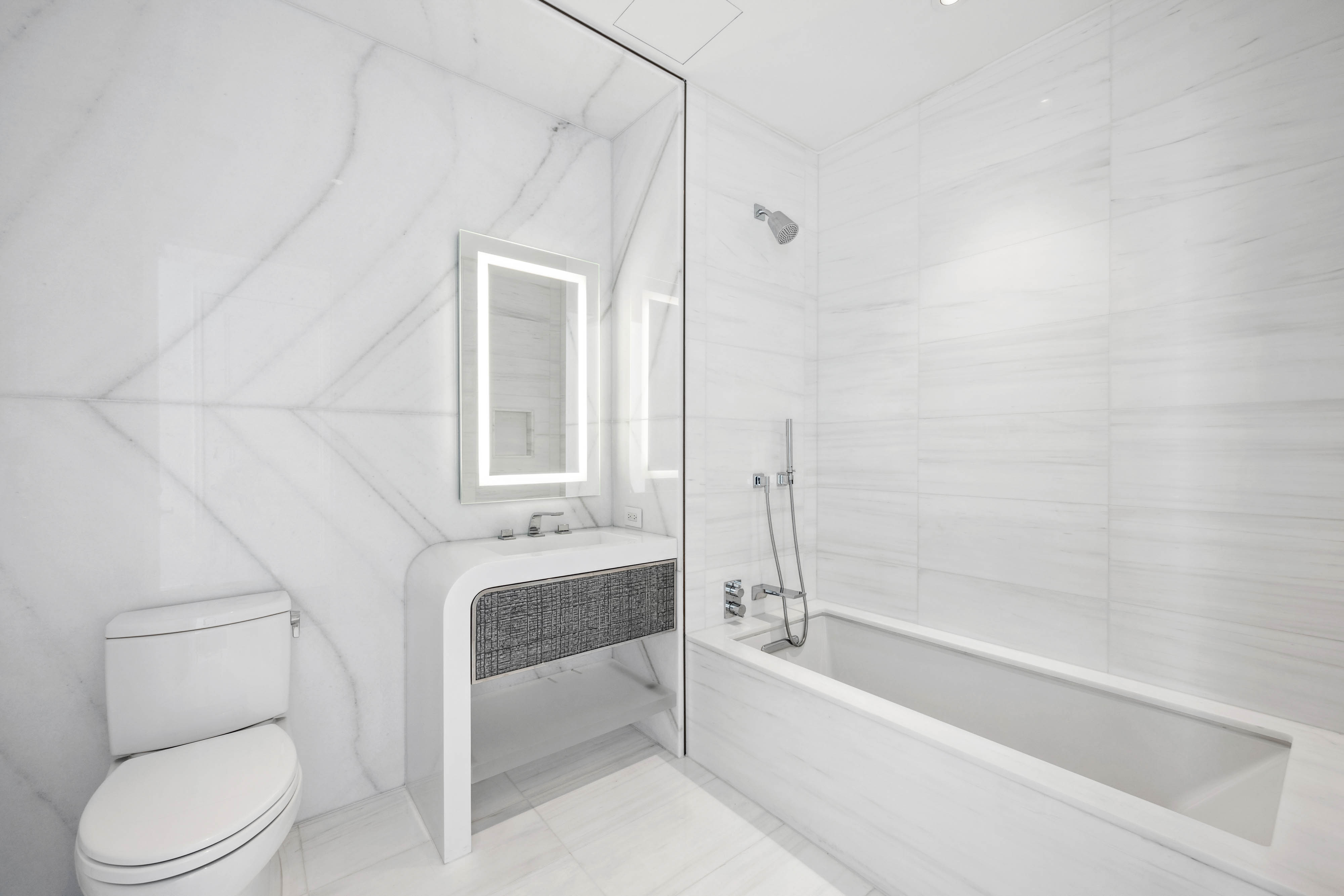 35 Hudson Yards, Unit 6201 Manhattan, NY 10001 - Photo 8 of 32 a bathroom with a bathtub and a toilet
