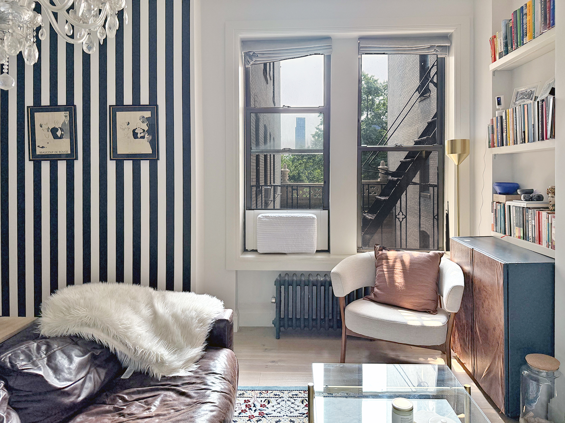 418 Central Park West, Unit 30 Manhattan, NY 10025 - Photo 3 of 12 a living room with furniture and a book shelf