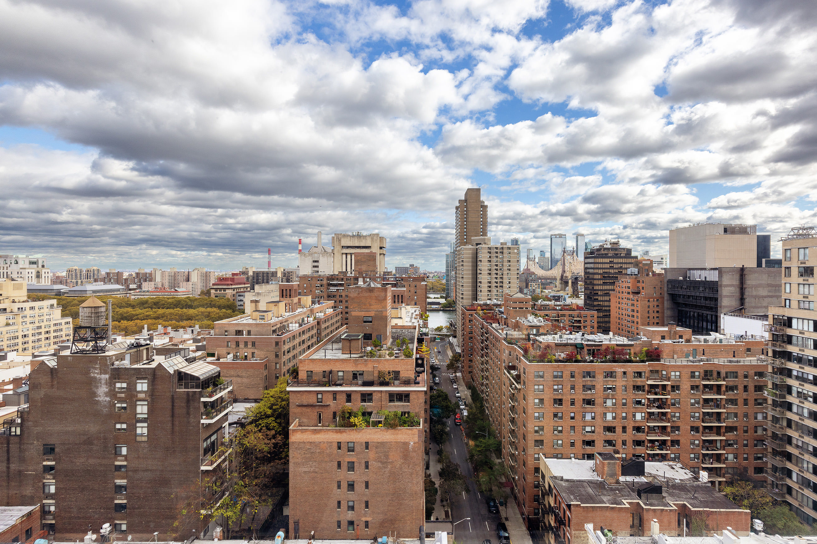 340 East 64th Street, Unit 19L Manhattan, NY 10065 - Photo 16 of 17 a view of a city with tall buildings