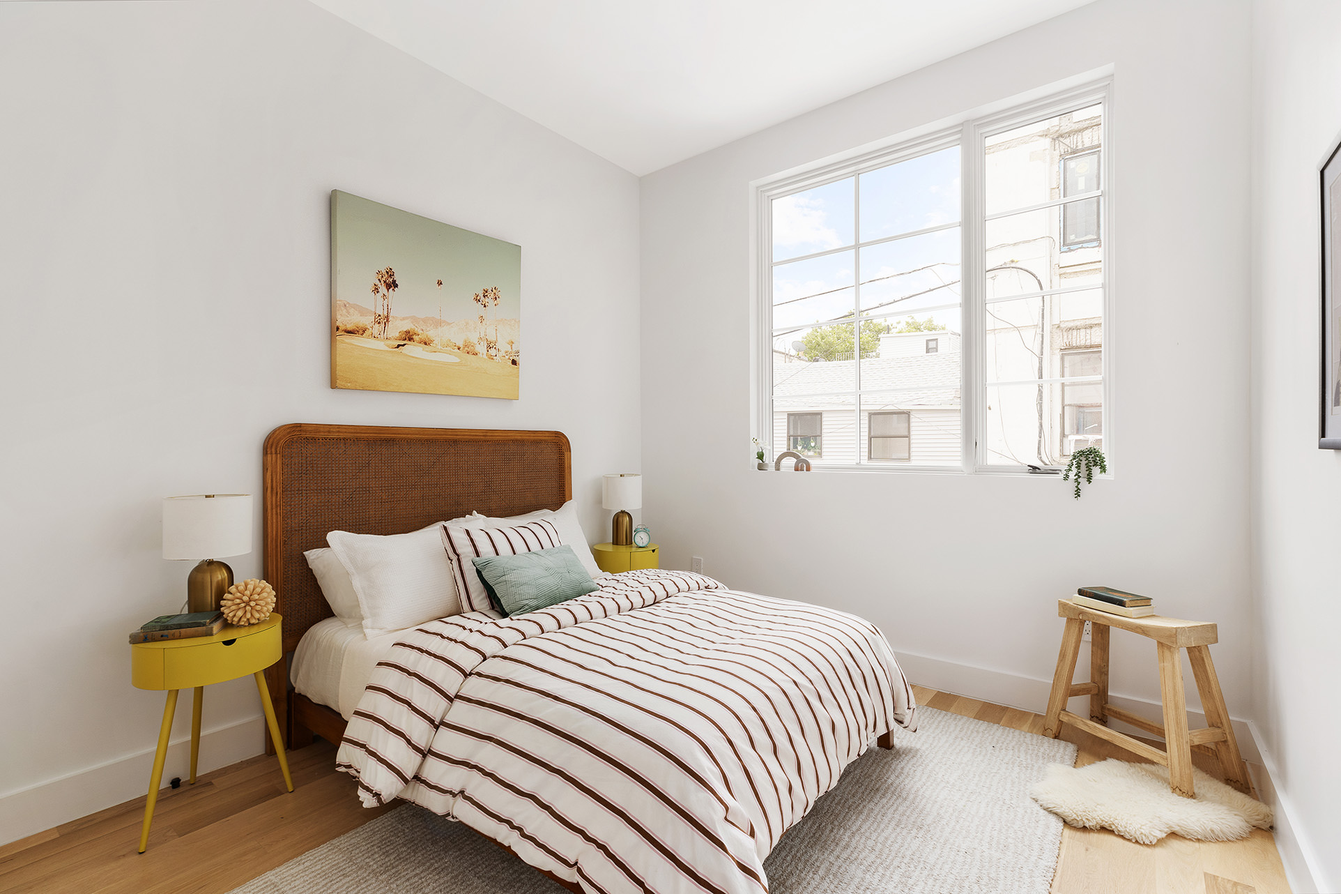 262 17th Street, Unit PH Brooklyn, NY 11215 - Photo 9 of 15 a bedroom with a bed and painting on the wall