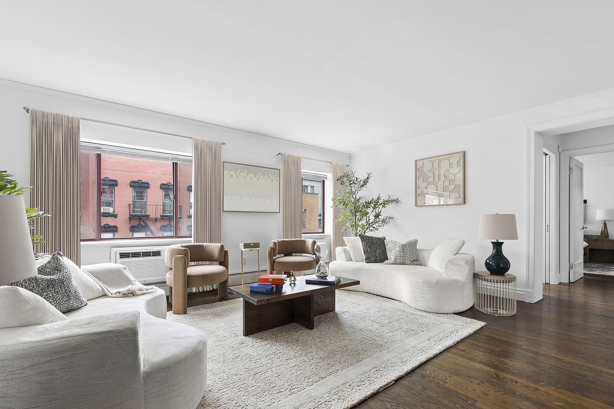 a living room with furniture or couch and a large window