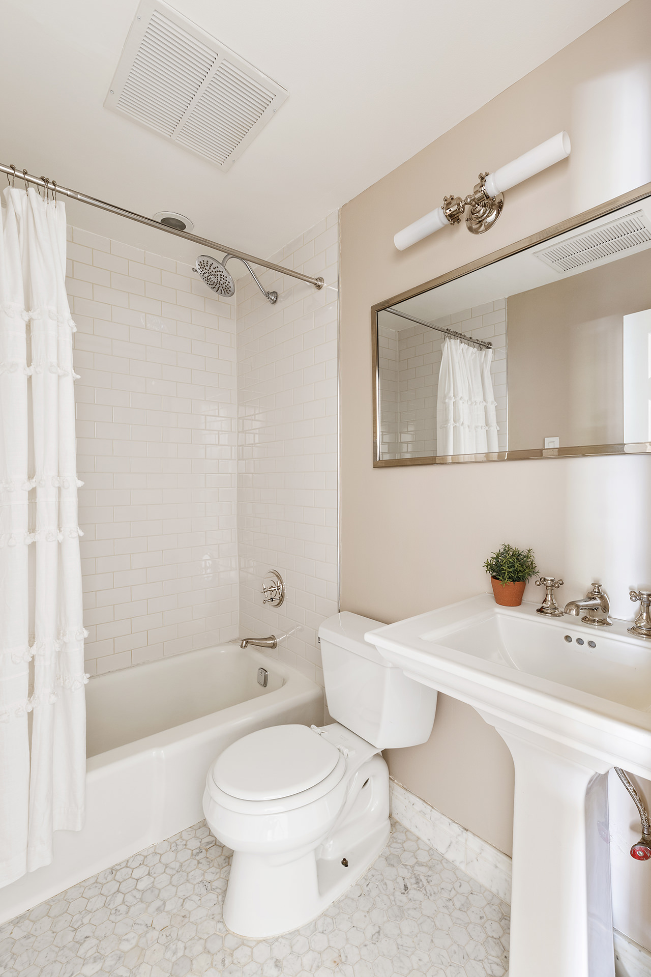 283 Hicks Street, Unit 4B Brooklyn, NY 11201 - Photo 12 of 15 a bathroom with a sink a toilet and shower