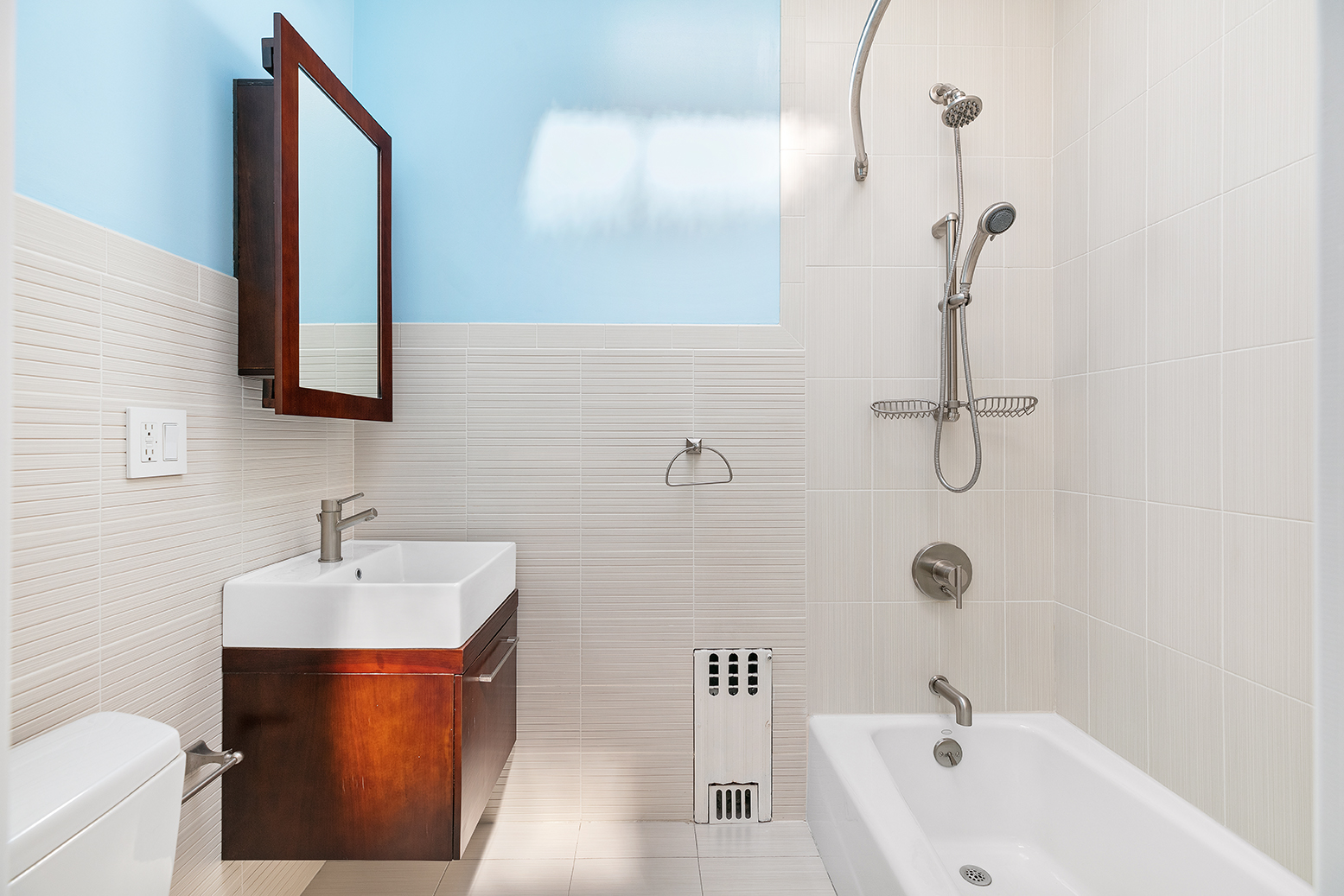 428 5th Street Brooklyn, NY 11215 - Photo 21 of 26 a bathroom with a sink a toilet and shower