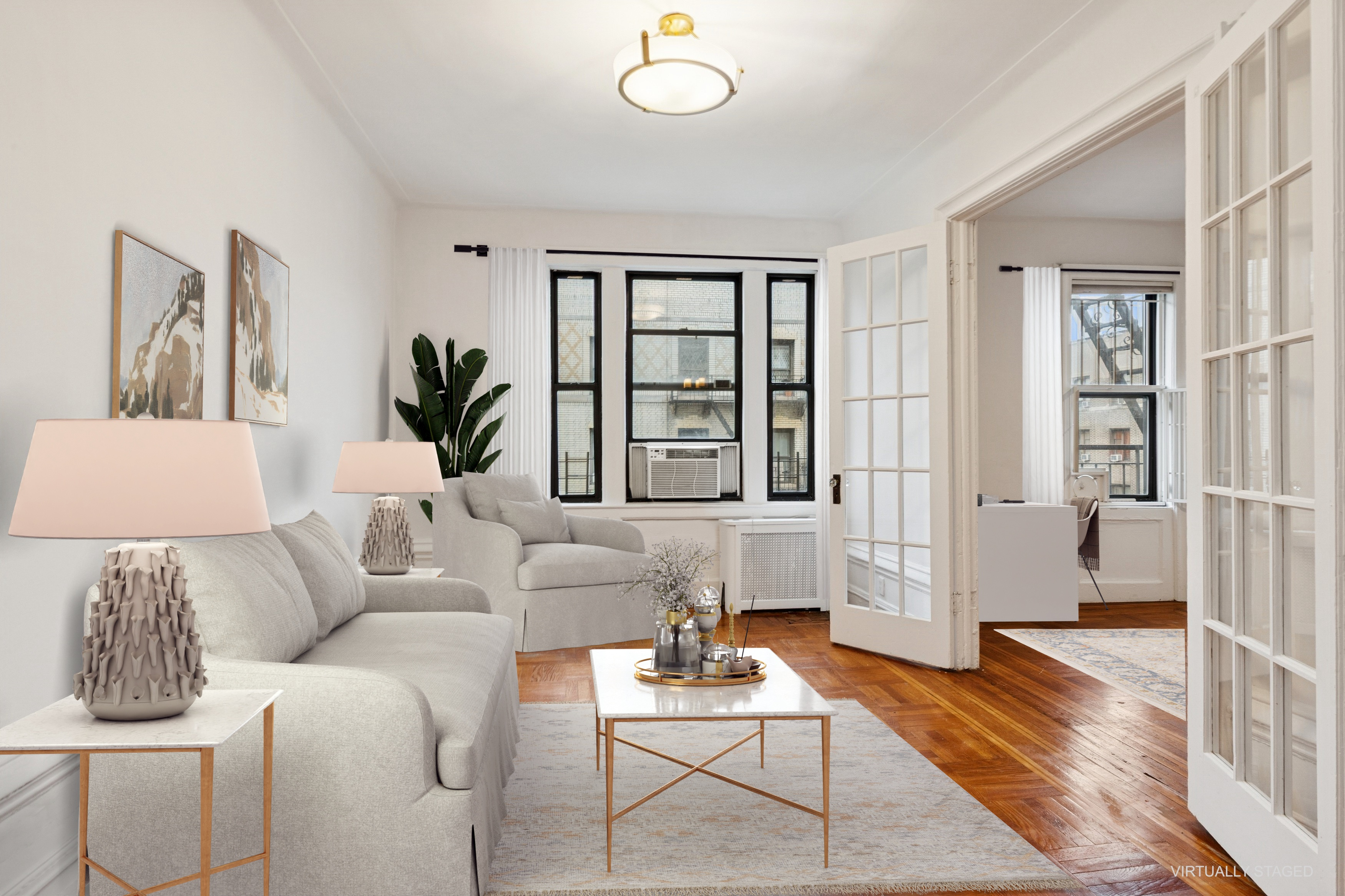 a living room with furniture and a large window