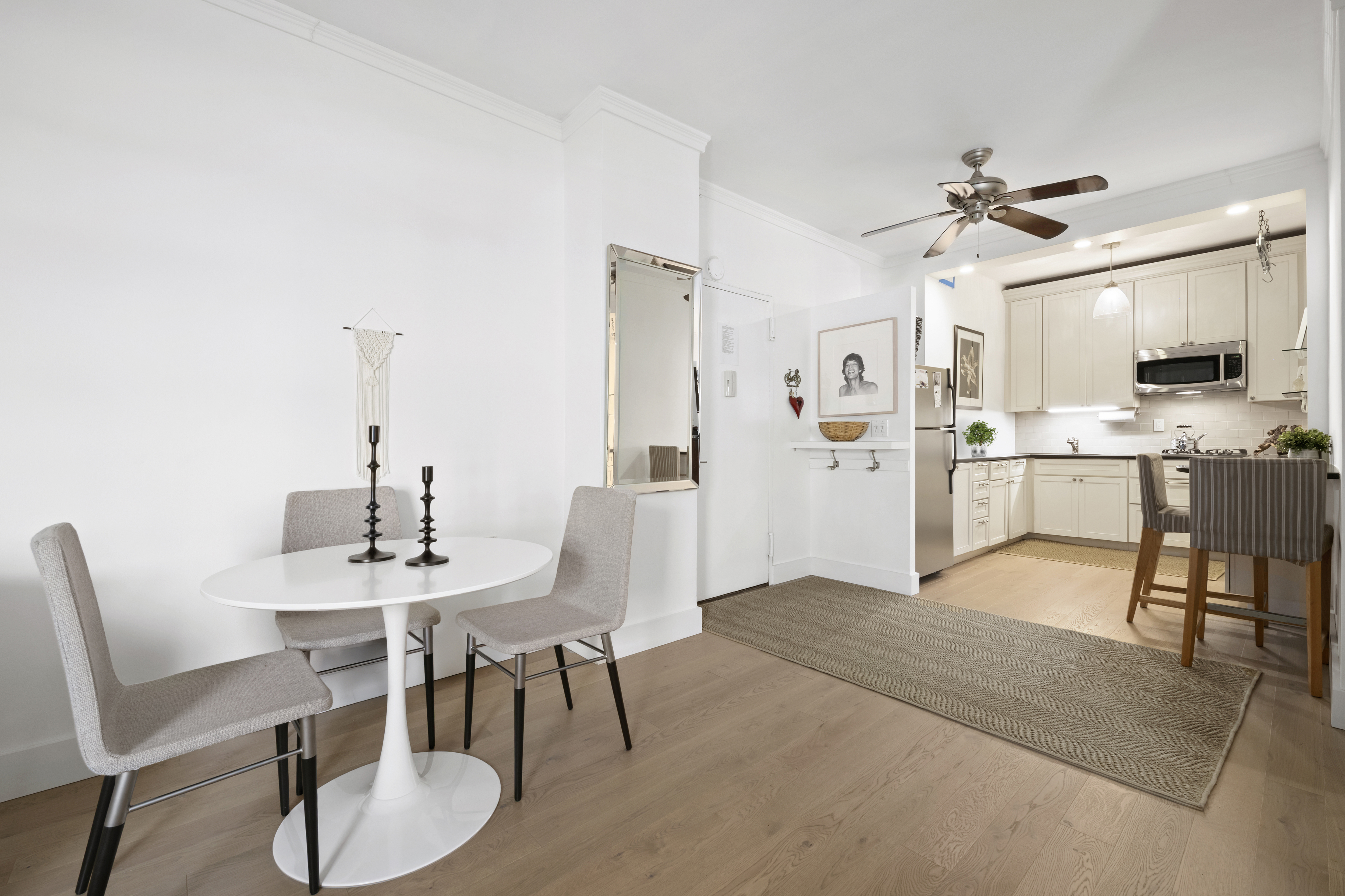 201 East 21st Street, Unit 12M Manhattan, NY 10010 - Photo 3 of 10 a view of a dining room with furniture and a kitchen
