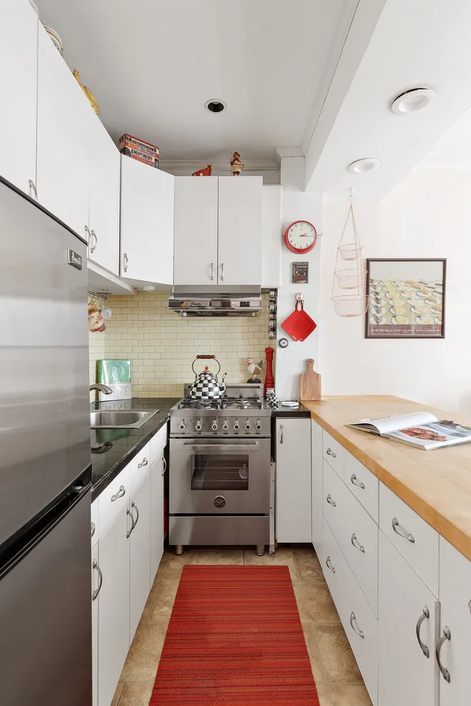 a view of a kitchen with appliances