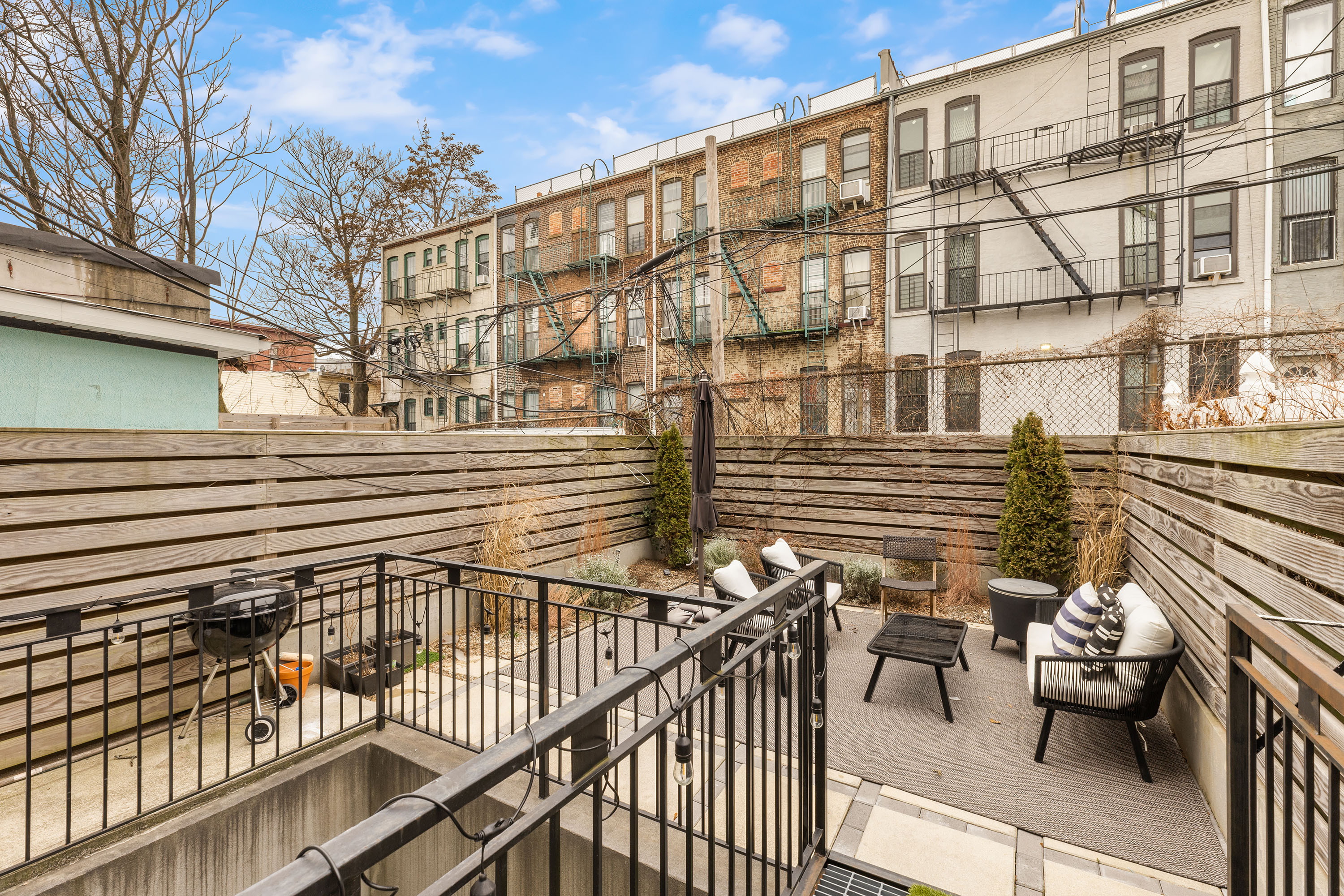 729 Decatur Street, Unit 1 Brooklyn, NY 11233 - Photo 3 of 7 a view of a balcony with chairs
