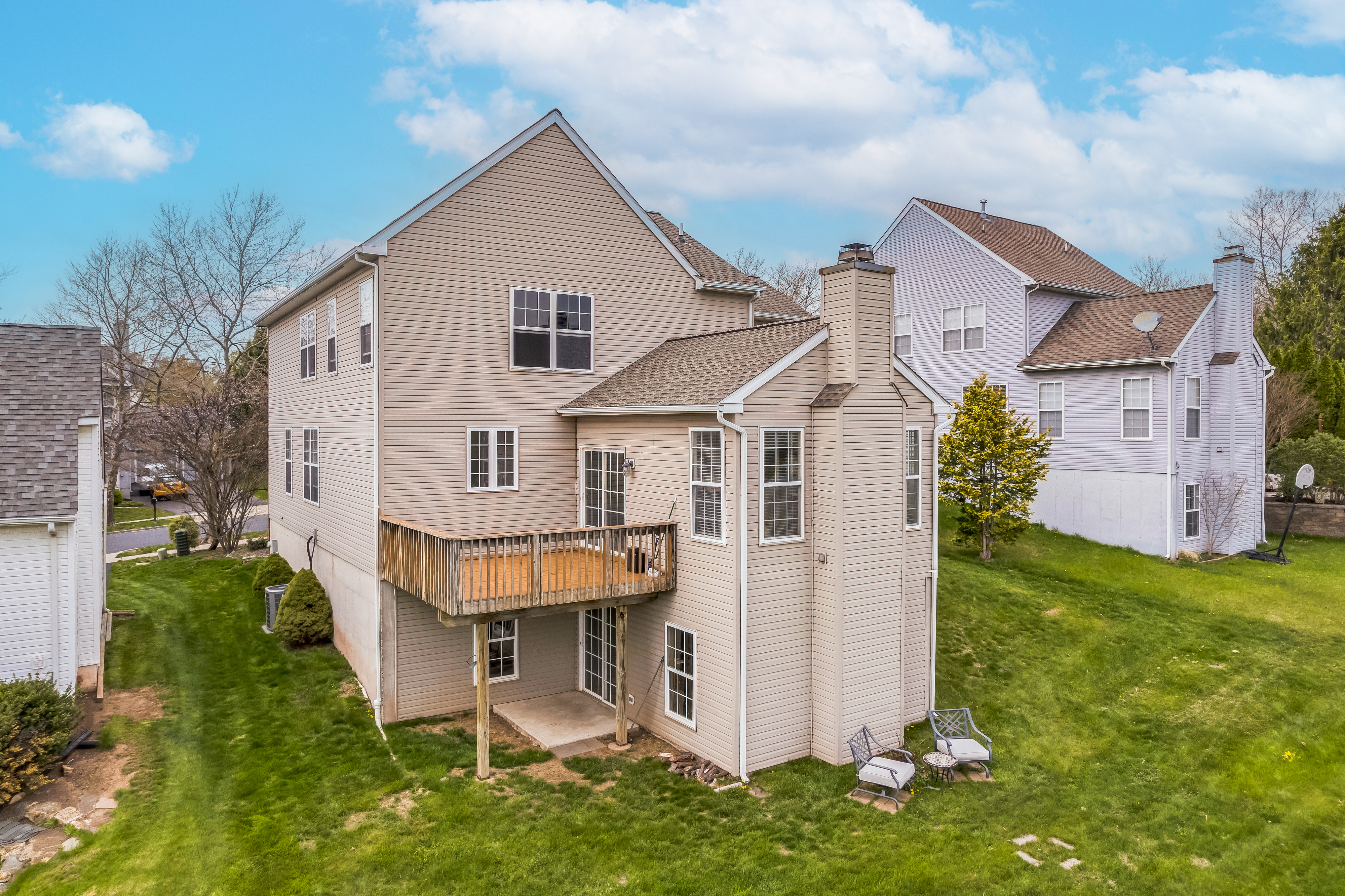 127 Hartman Road Pottstown, PA 19465 - Photo 33 of 42 a view of a white house next to a yard with big trees