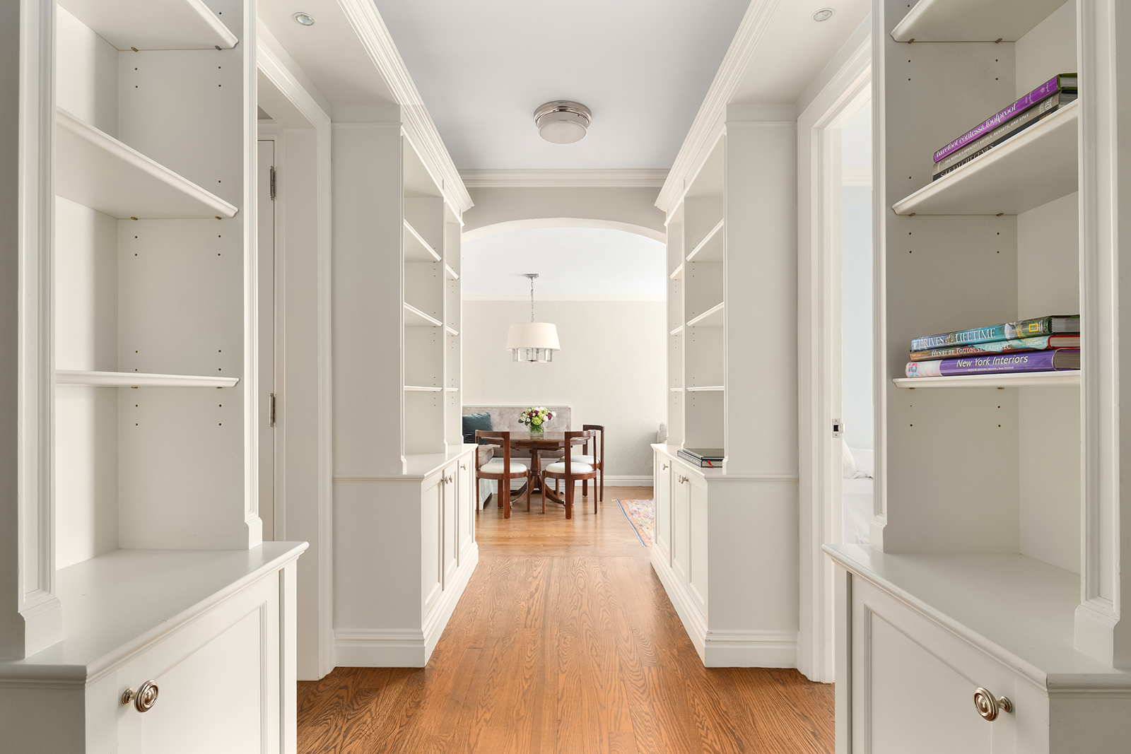 75 Bank Street, Unit 2H Manhattan, NY 10014 - Photo 5 of 18 a view of a hallway with wooden floor and furniture
