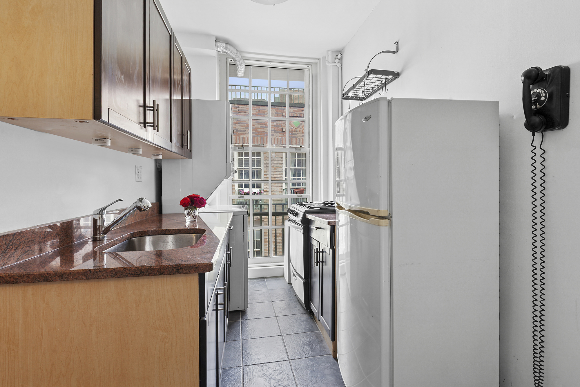509 East 77th Street, Unit 6G Manhattan, NY 10075 - Photo 4 of 10 a bathroom with a sink a mirror and shower