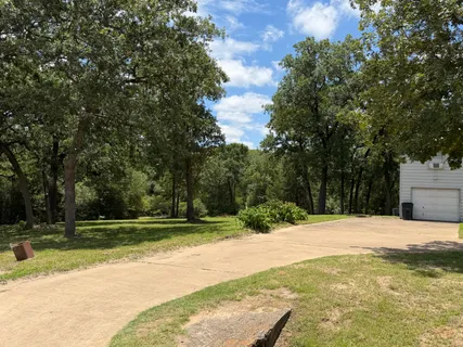 a view of outdoor space with deck and yard
