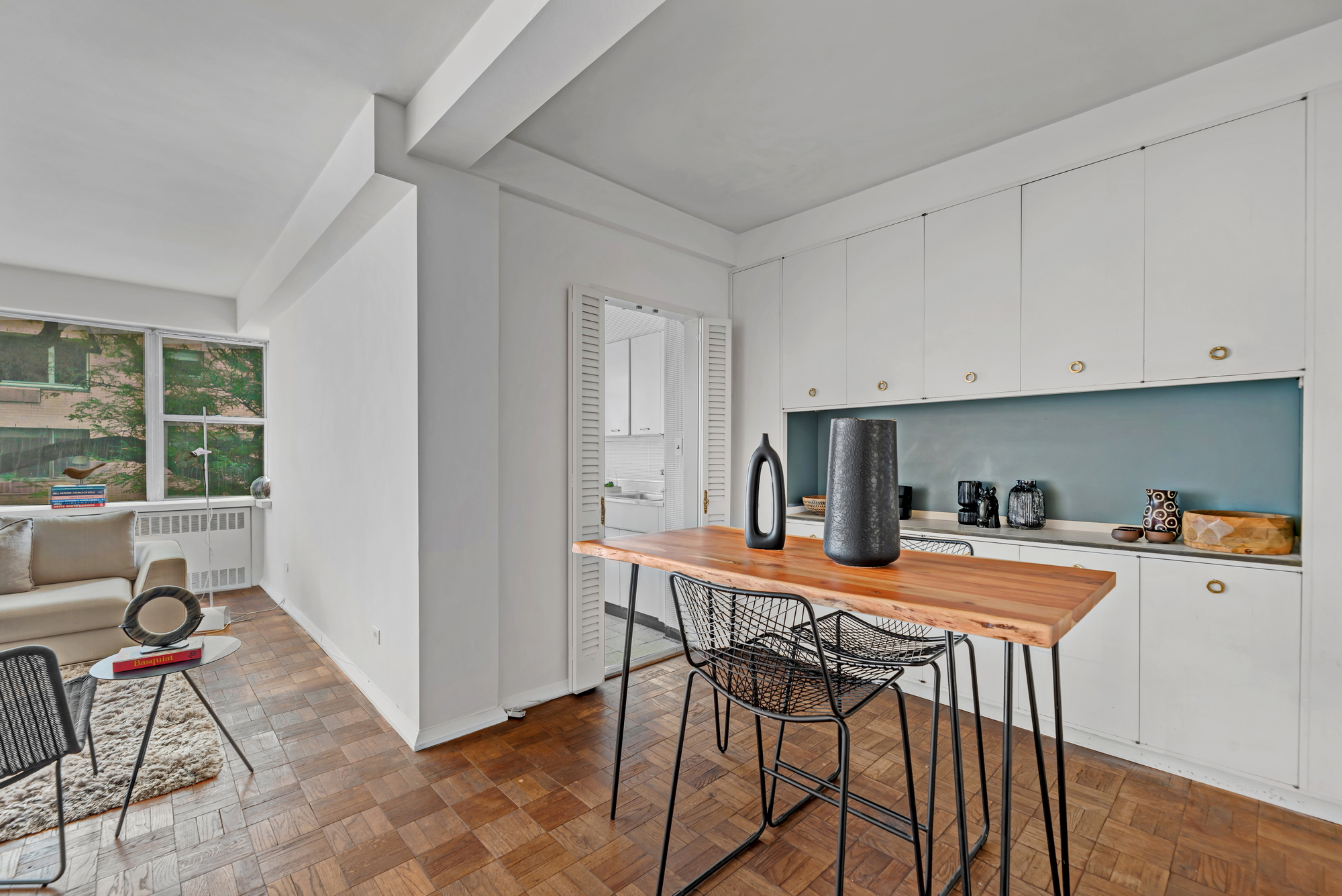 45 Sutton Place South, Unit 3D Manhattan, NY 10022 - Photo 3 of 16 a dining room with furniture and window