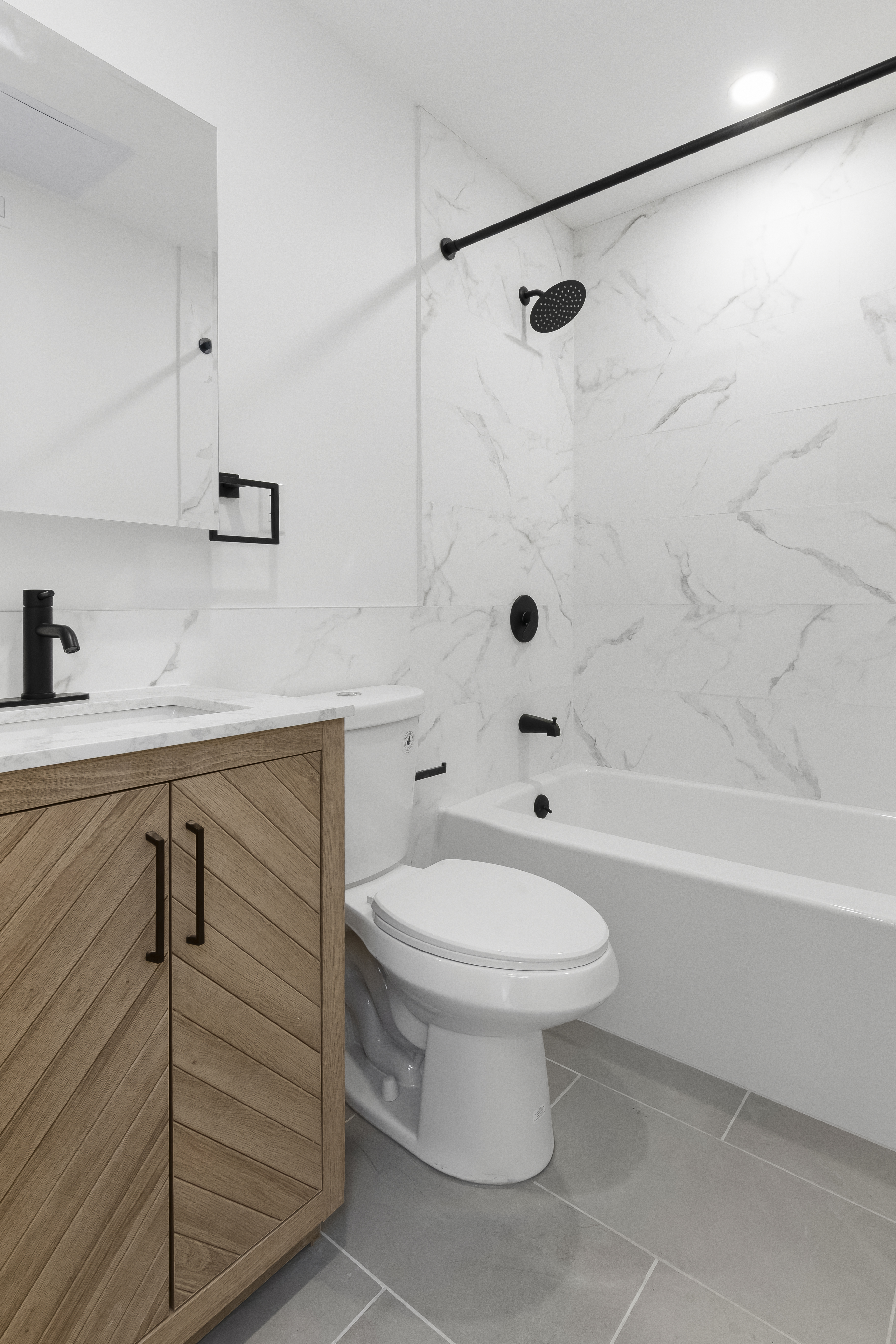 297 3rd Avenue, Unit 1 Brooklyn, NY 11215 - Photo 3 of 8 a bathroom with a sink a toilet and shower