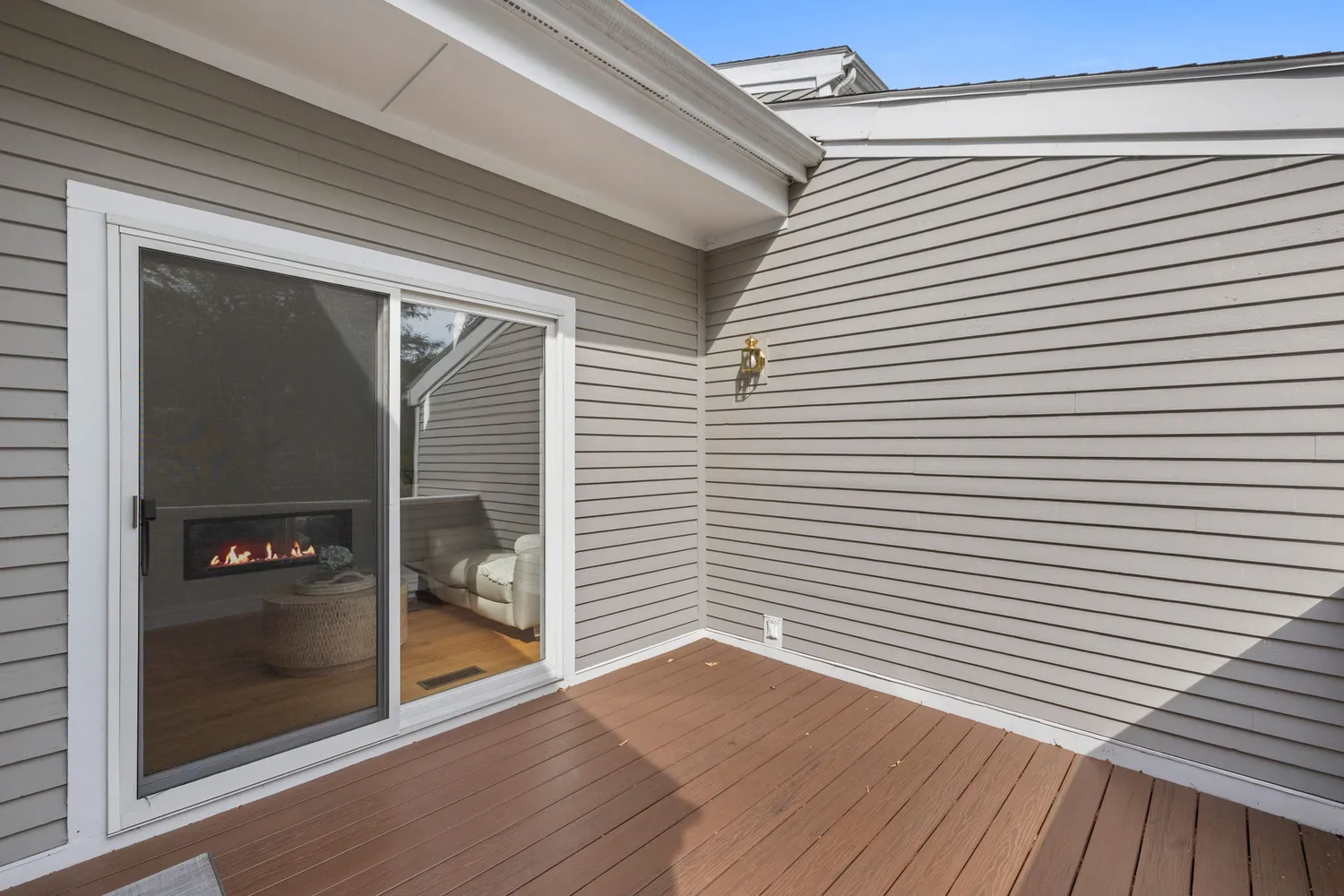 a view of a two room with wooden floor