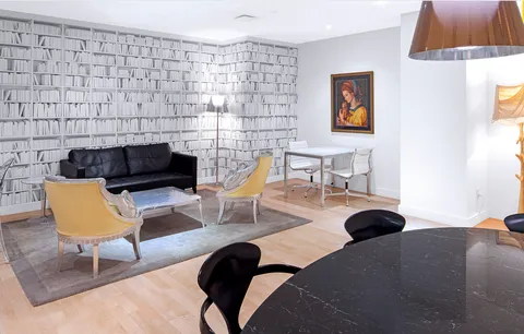 a living room with furniture and a rug