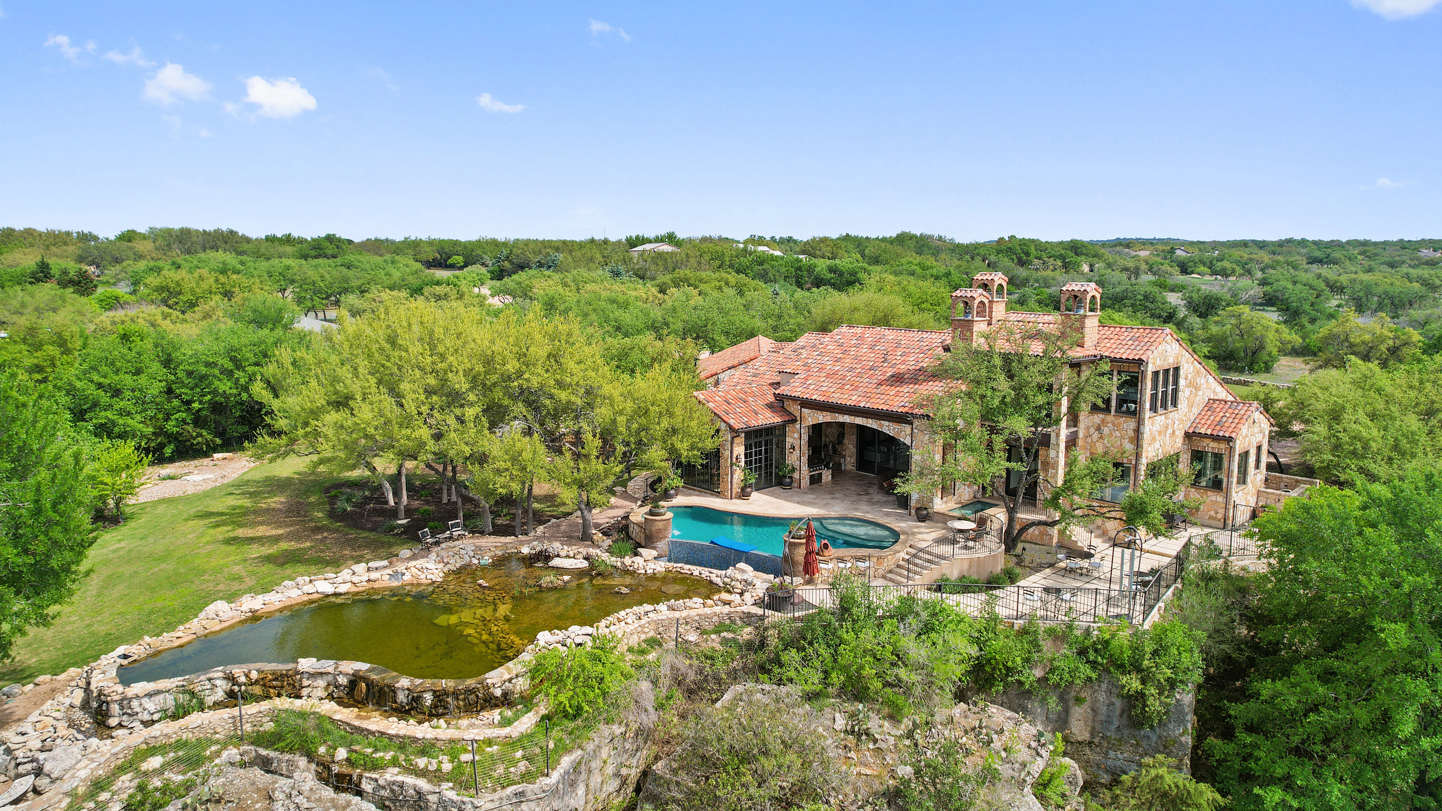 808 Rivercliff Drive Spicewood, TX 78669 - Photo 67 of 71 an aerial view of a house with a garden