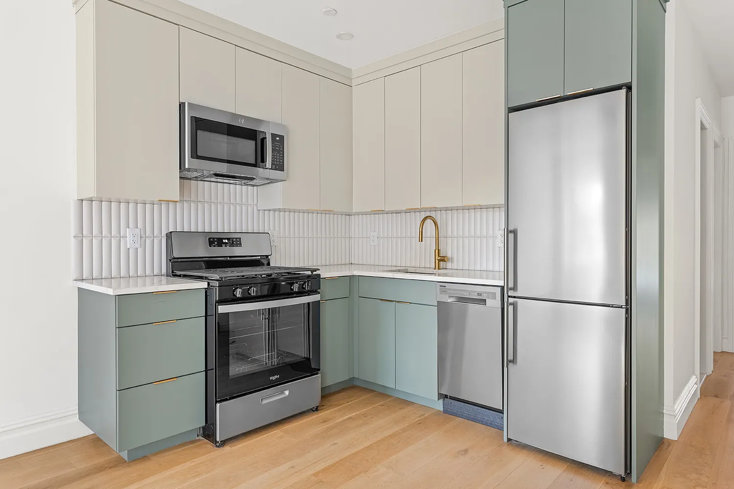 a kitchen with a refrigerator stove and microwave