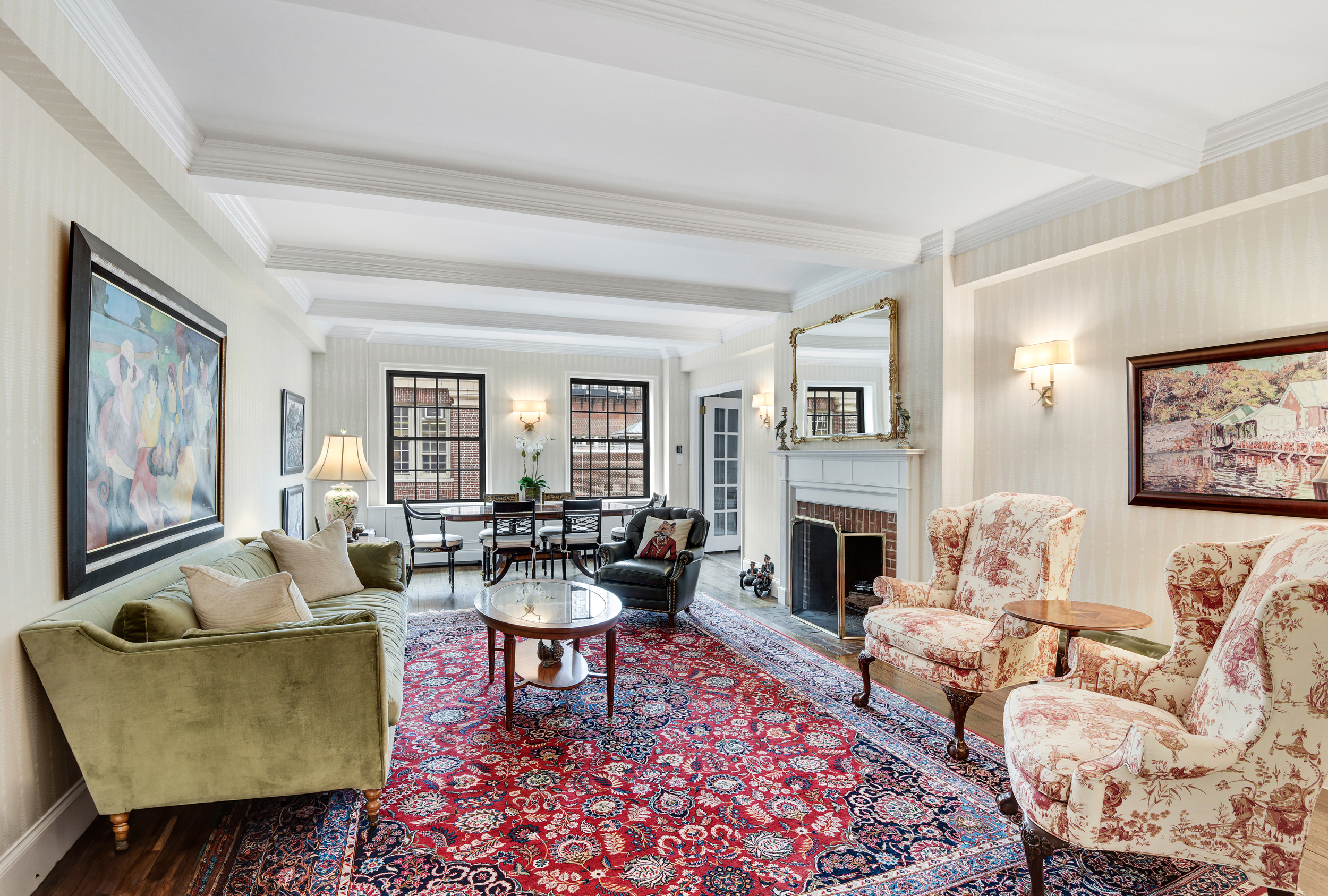 a living room with fireplace furniture and a fireplace