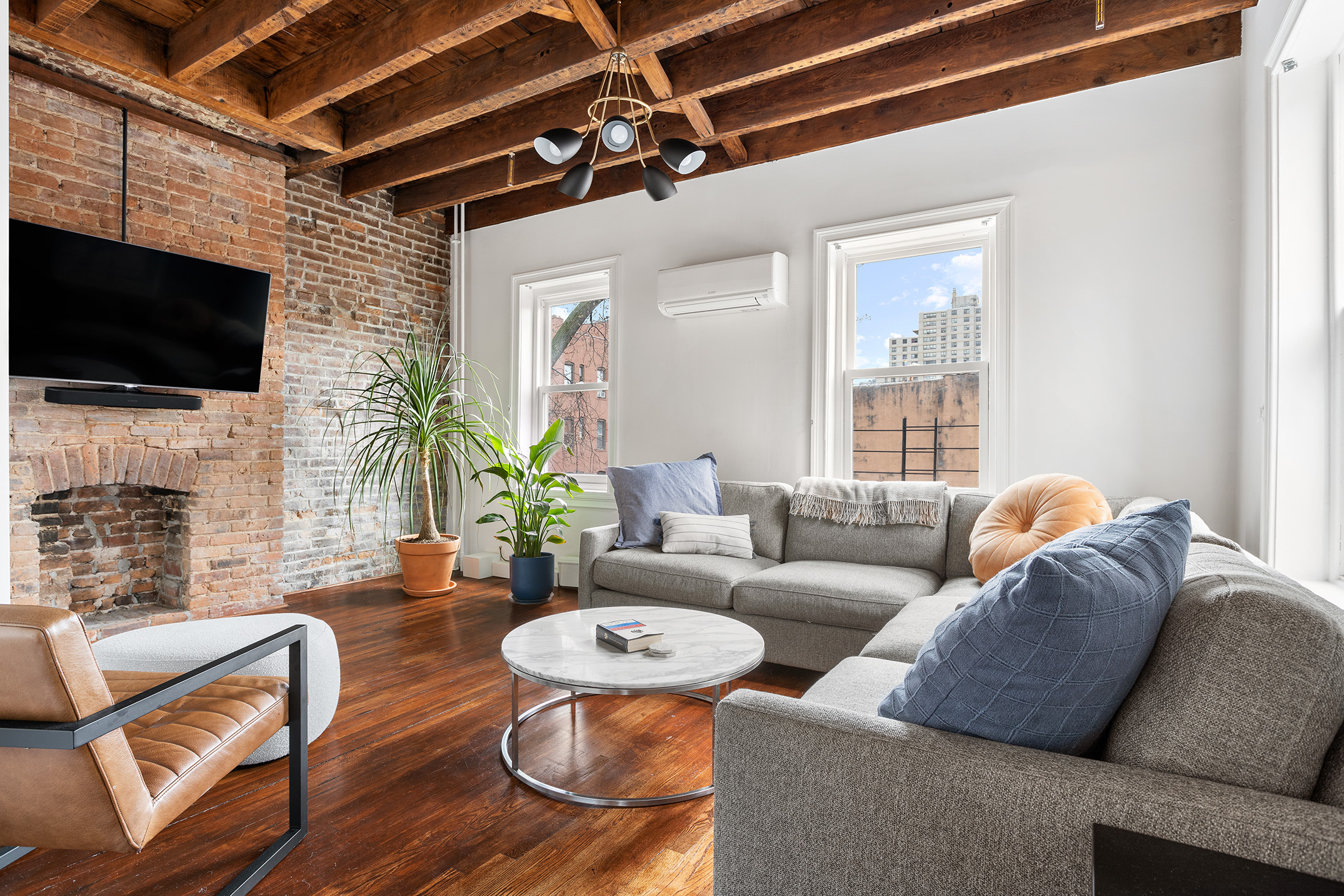 252 Dean Street, Unit 2 Brooklyn, NY 11217 - Photo 3 of 9 a living room with fireplace furniture and a flat screen tv