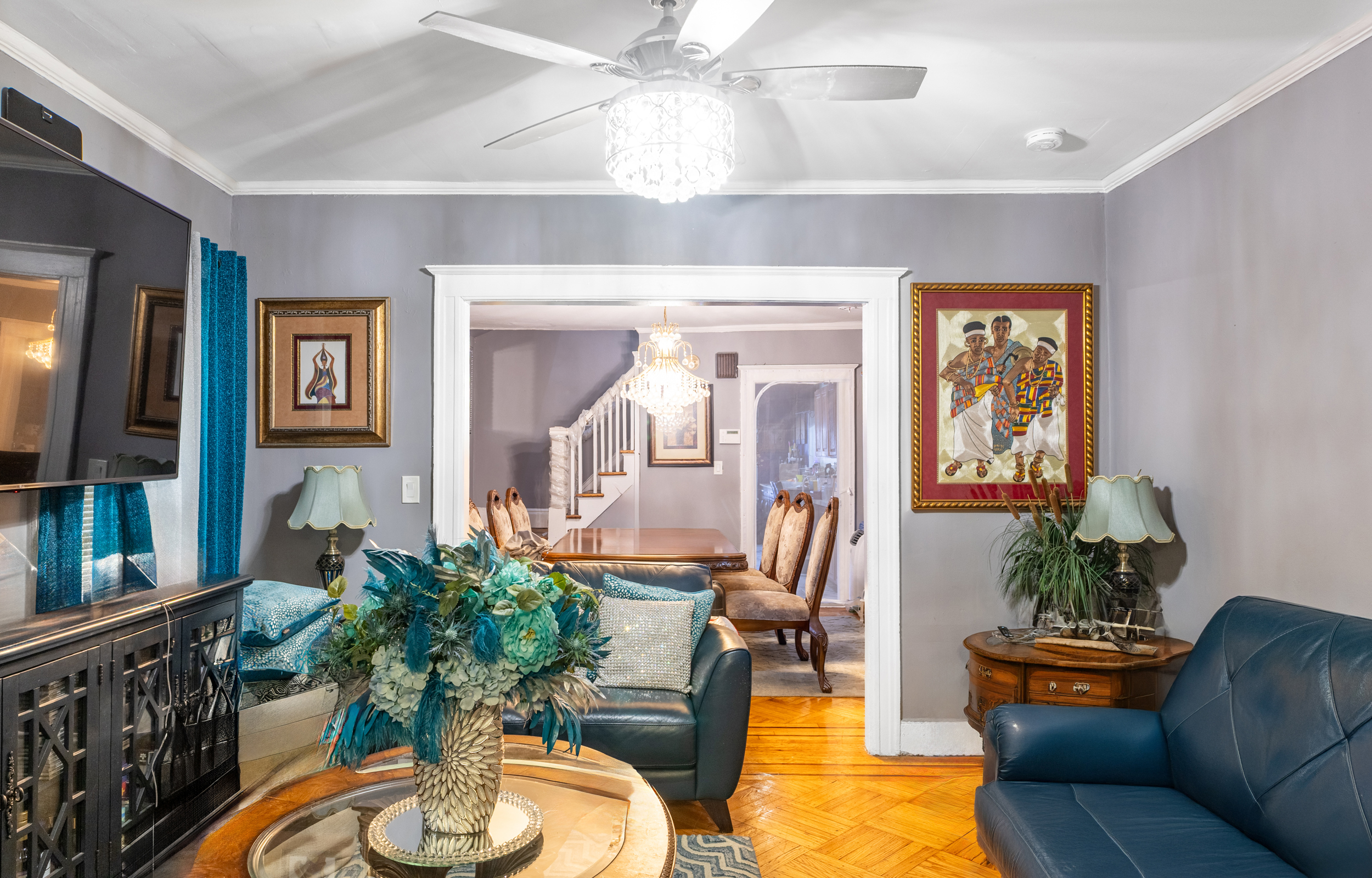 961 East 32nd Street Brooklyn, NY 11210 - Photo 3 of 24 a living room with furniture and a potted plant