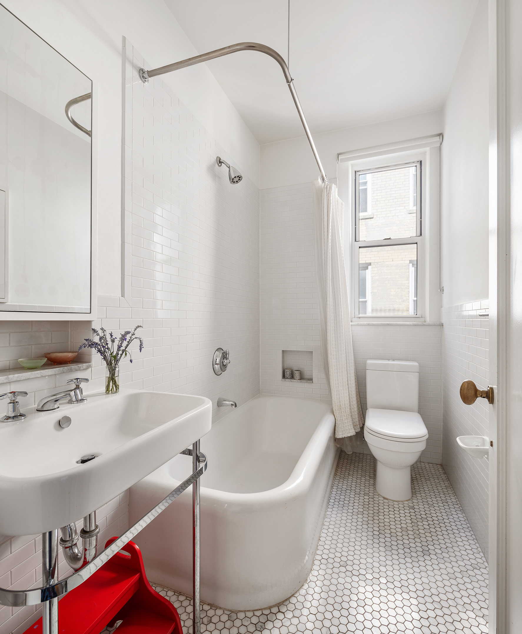 41 Eastern Parkway, Unit 11E Brooklyn, NY 11238 - Photo 11 of 14 a bathroom with a sink toilet and shower