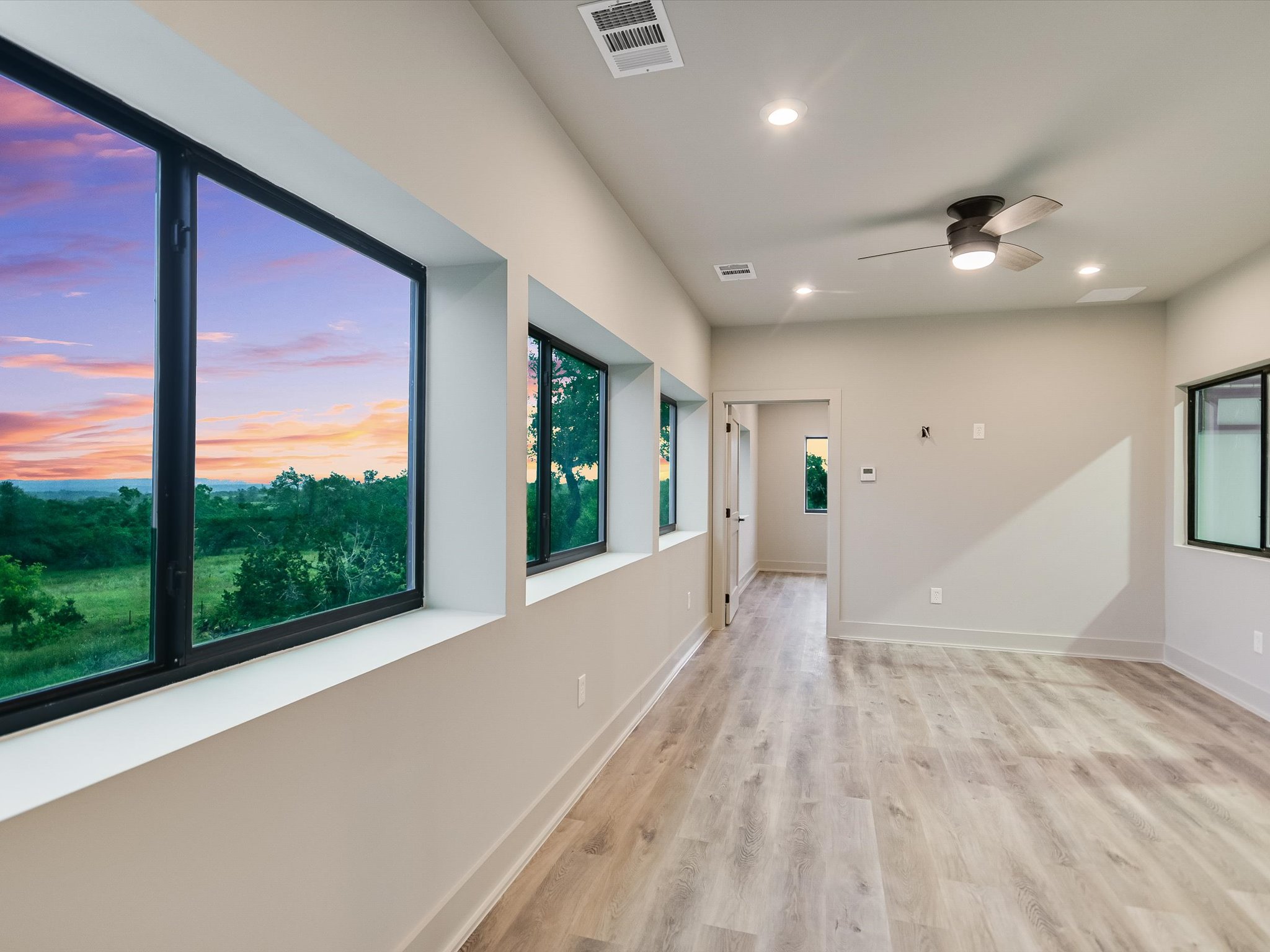 15210 Fitzhugh Road, Unit 800 Austin, TX 78736 - Photo 15 of 18 a view of hallway with a large window