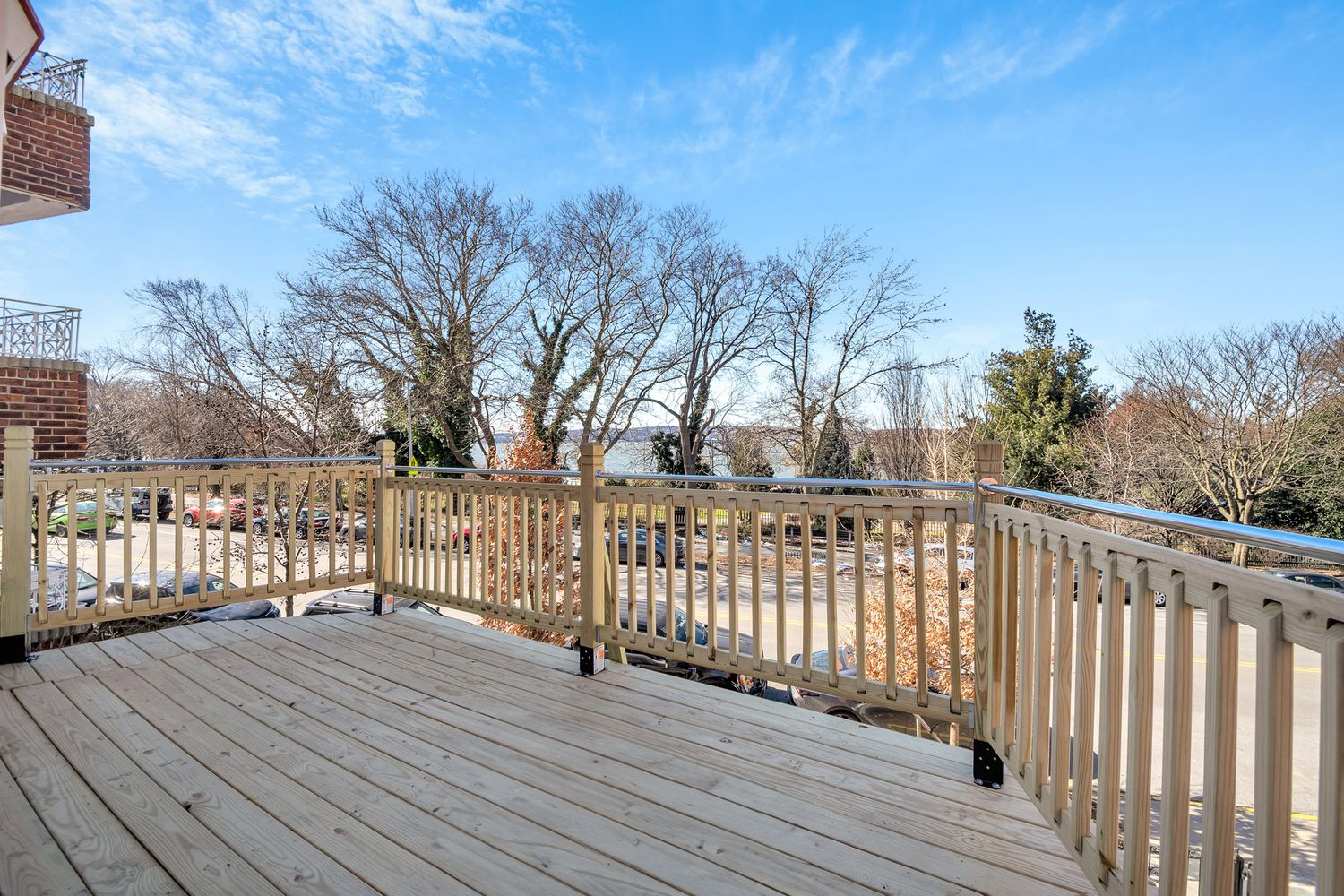 7001 Shore Road, Unit 2 Brooklyn, NY 11209 - Photo 4 of 17 a view of deck with wooden floor and fence