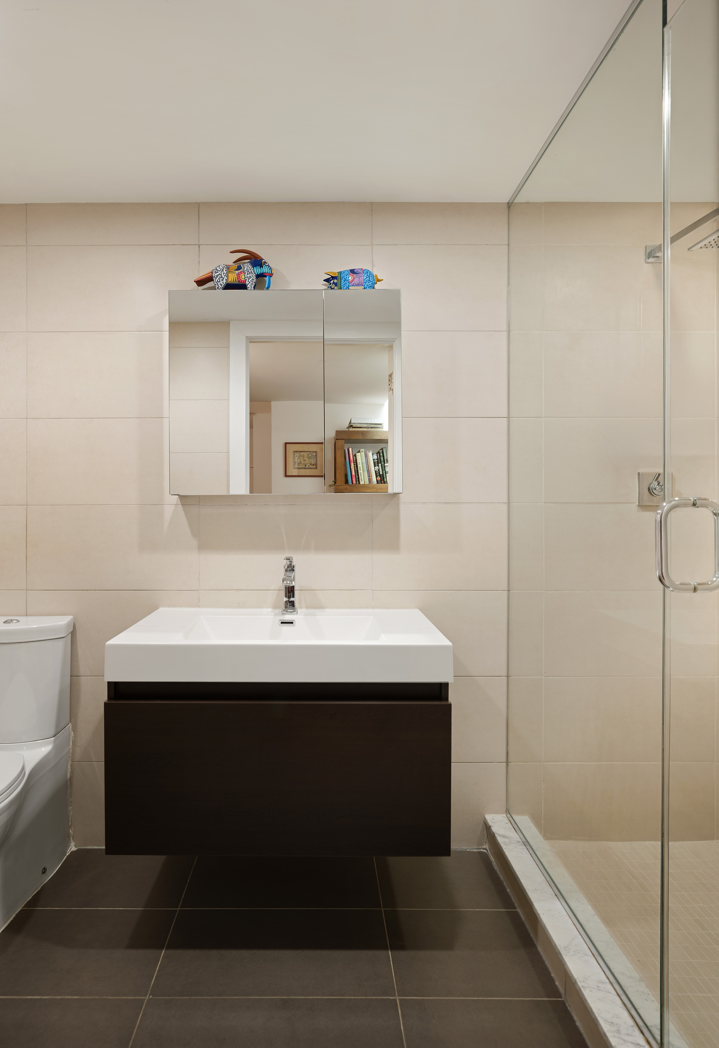 176 Broadway, Unit 3C Manhattan, NY 10038 - Photo 7 of 8 a bathroom with a sink and a mirror