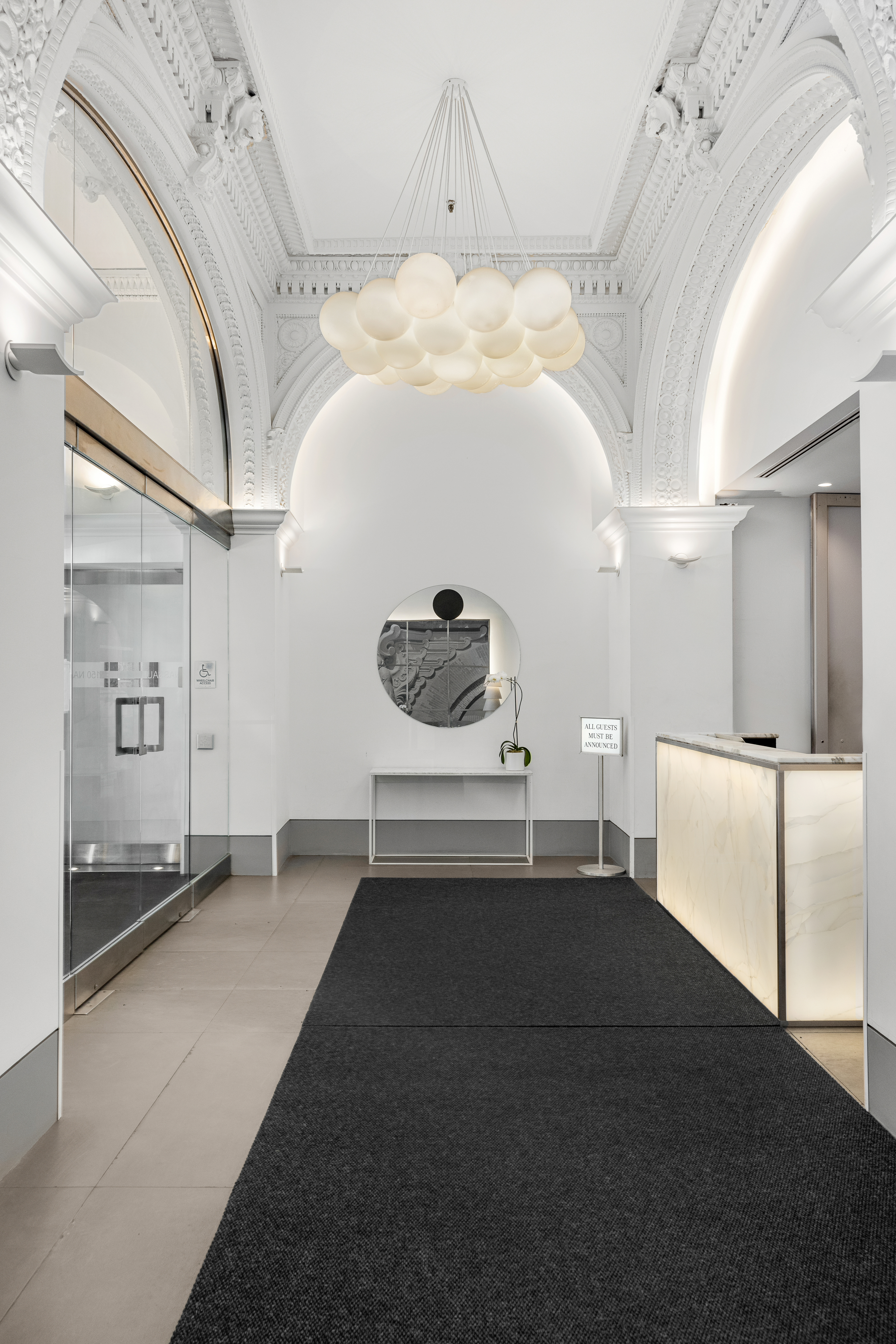 150 Nassau Street, Unit 19A Manhattan, NY 10038 - Photo 9 of 16 a view of a hallway with a couch