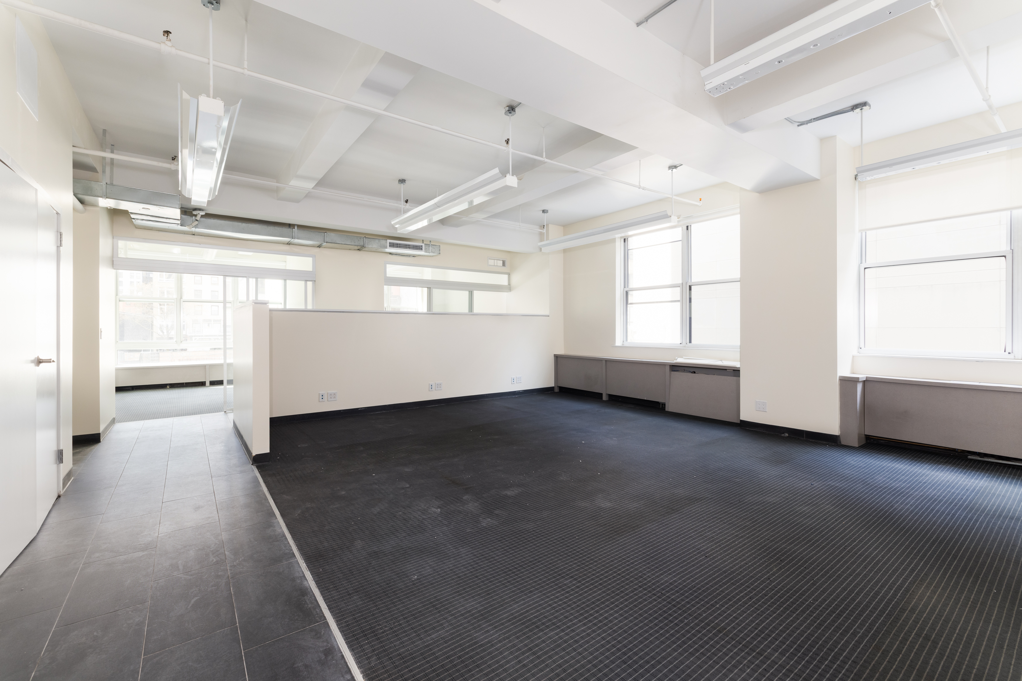 11 West 30th Street, Unit 2F Manhattan, NY 10001 - Photo 7 of 12 a view of an empty room with a window